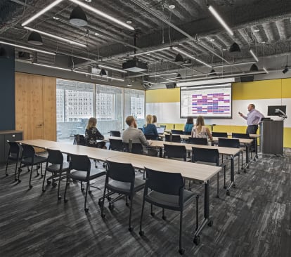 This classroom area features DIRTT's modular solid and glass walls along with writeable surfaces.