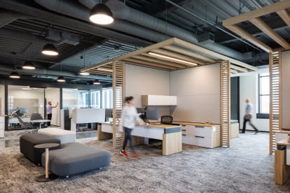A system of DIRTT products are used in this office space to divide spaces including Timber Frame, custom casework, and solid and glass modular walls.
