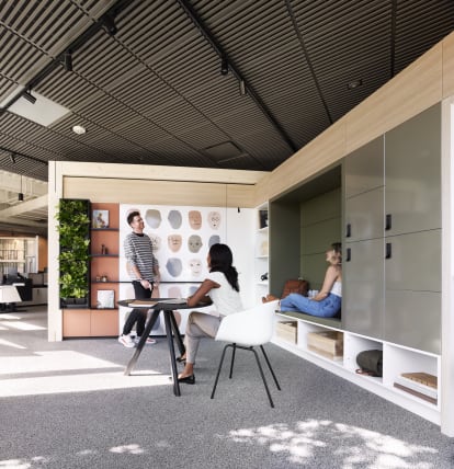 This space in the DIRTT DXC showcases custom casework lockers and shelves as well as magnetic and writeable surfaces.