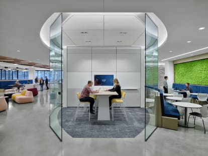 Integrated technology within a solid and glass wall meeting room