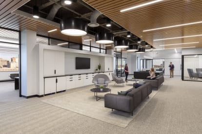 This open waiting area faces a long stretch of DIRTT's custom casework cabinets and drawers.