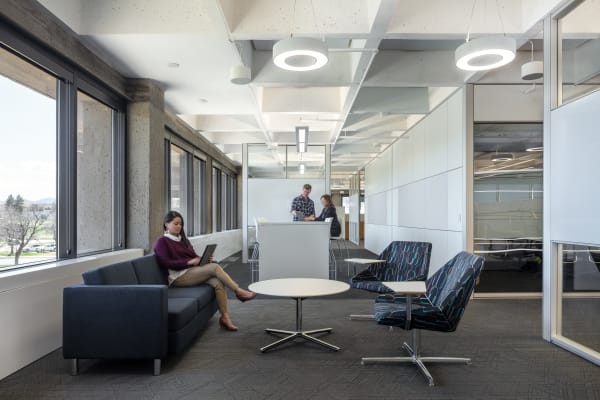 Federal office building open space with raised floor system, prefab office walls with modular glass walls