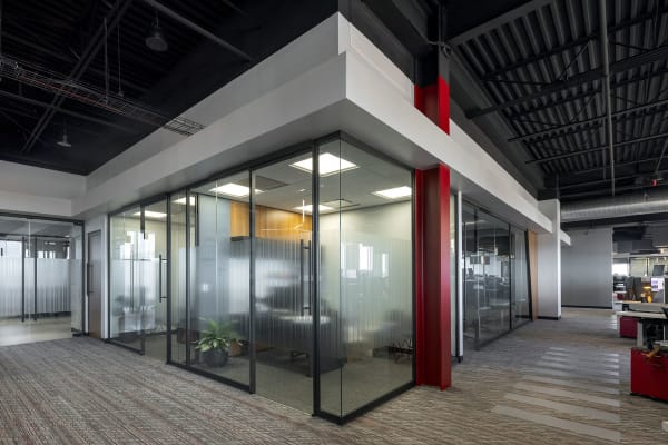 DIRTT project: pb2 architecture + engineering 4 inch solid wall, angled panels, applied film, hallway, inspire 90 degree corner, inspire frameless glass sliding door, inspire glass wall, powder coat, private office, solid wall, veneer