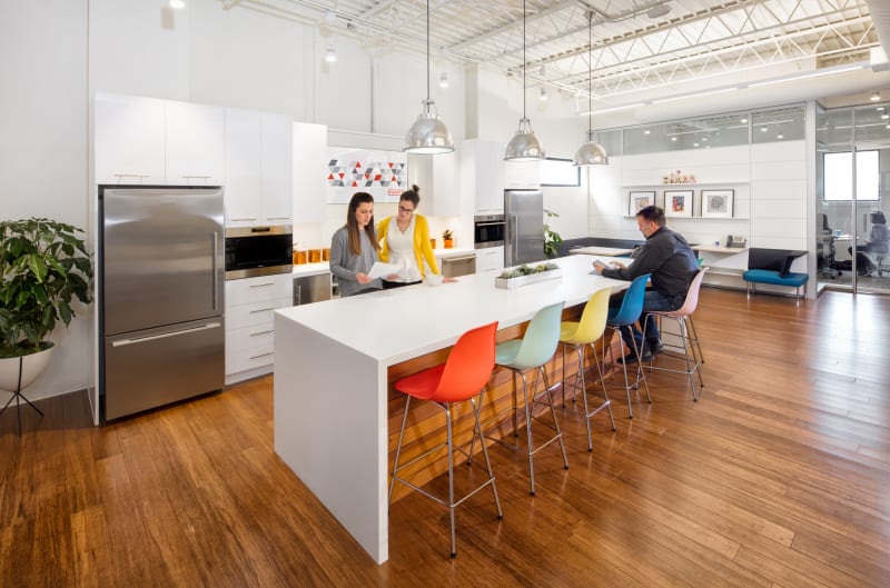 This kitchen area in a DIRTT design center features custom casework and solid modular walls.