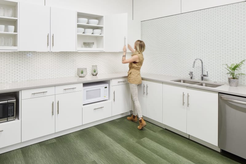 This kitchen area features DIRTT's custom casework cabinetry.