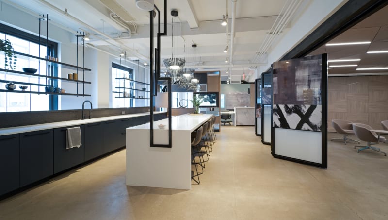 This kitchen breakroom area at DIRTT has a Leaf floating wall that opens up the space to the classroom area.