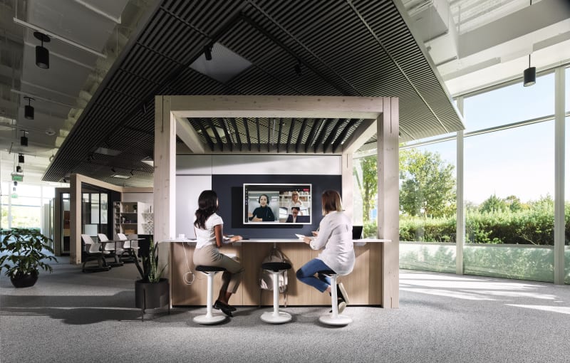 This Timber framed meeting area has perimeter seating and a solid DIRTT wall on one side with an integrated display.