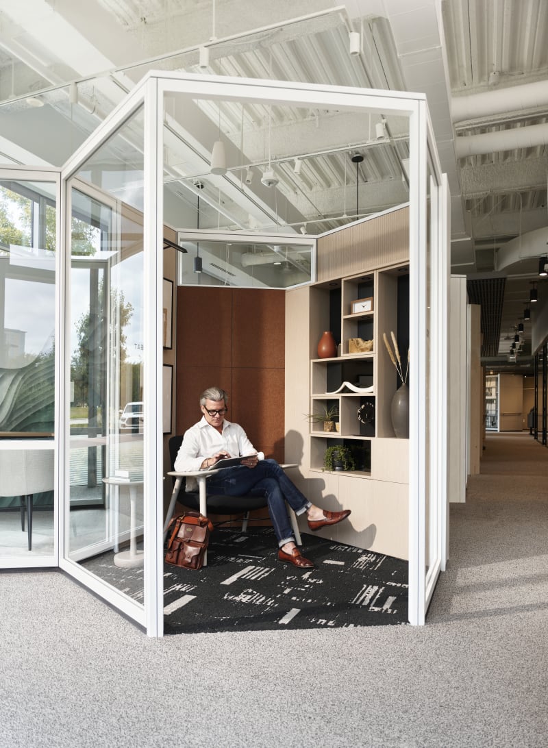 This small private solo seating area has Inspire glass walls and custom casework cabinets and shelves.