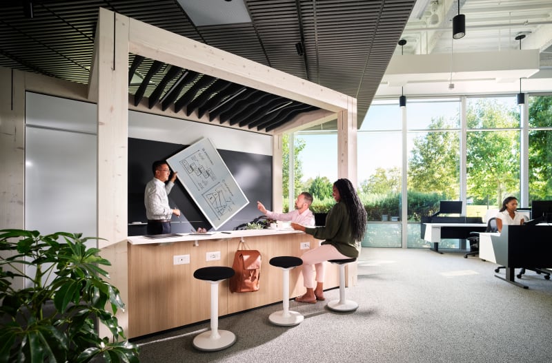 This Timber framed meeting area has perimeter seating and a solid DIRTT wall on one side with a writable area.