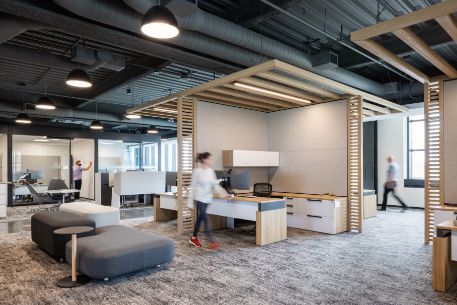 A system of DIRTT products are used in this office space to divide spaces including Timber Frame, custom casework, and solid and glass modular walls.