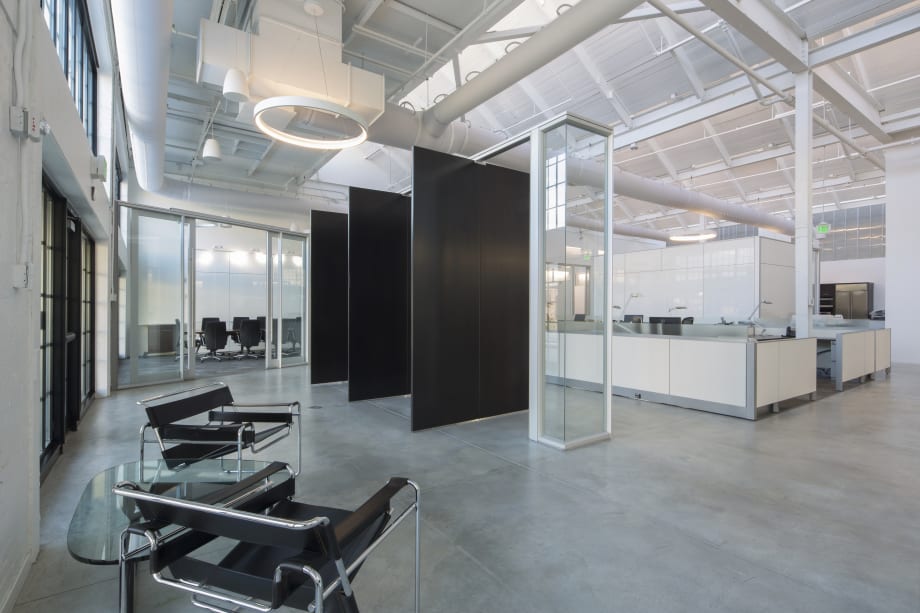 Pivoting interior doors leading into a collaborative office space