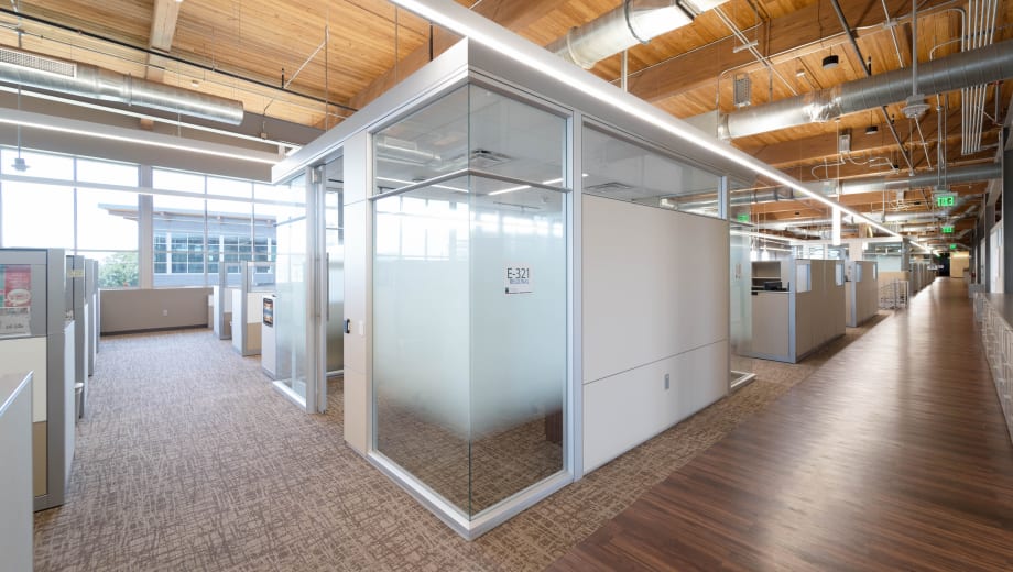 Image of modular solid and glass walls in a office environment