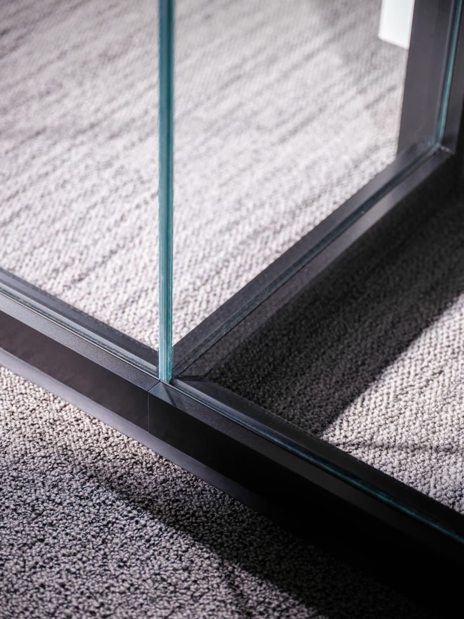 Close up detail shot to show product detail of Inspire modular glass wall base at the floor