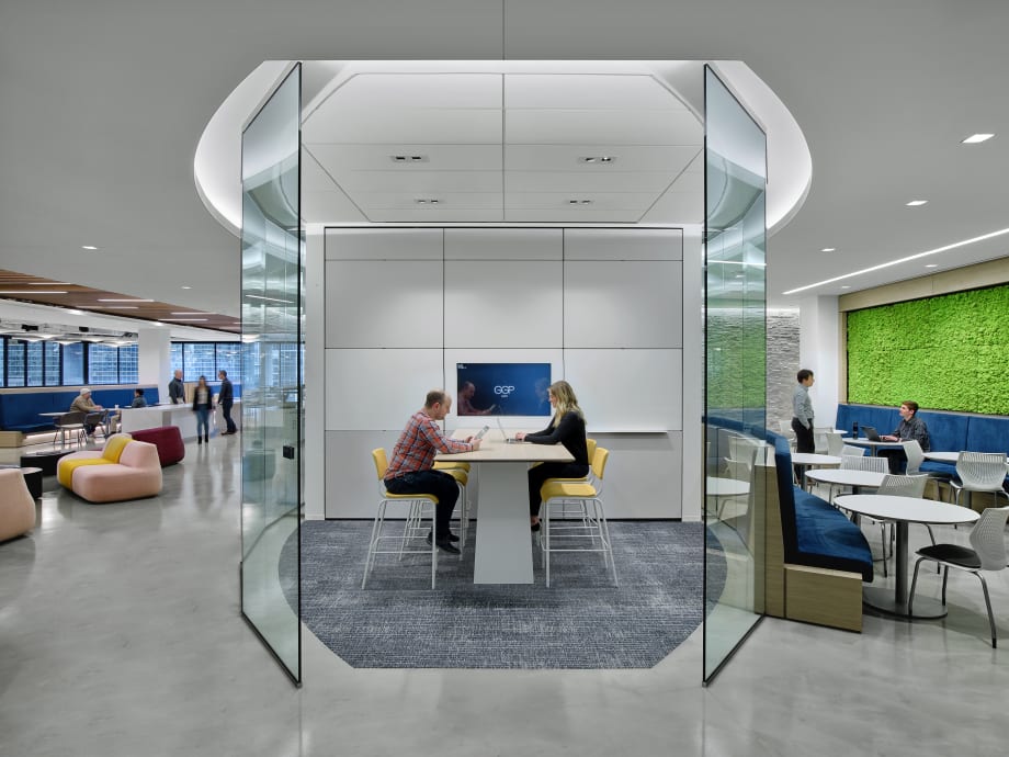 Integrated technology within a solid and glass wall meeting room