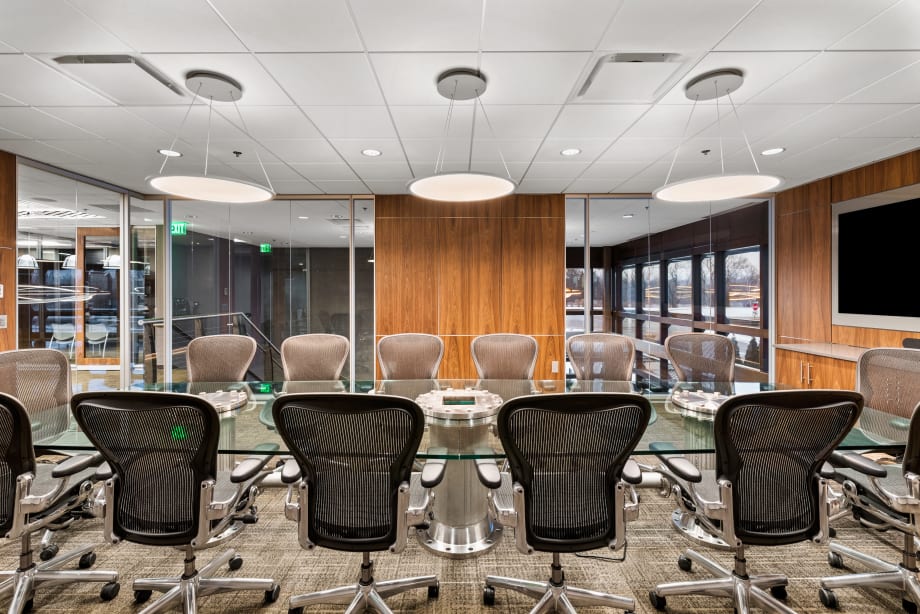 Combination glass and solid veneer modular walls are used for this conference room.