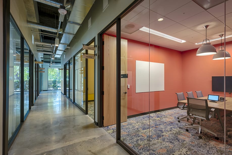 Image of an interior glass wall swinging door