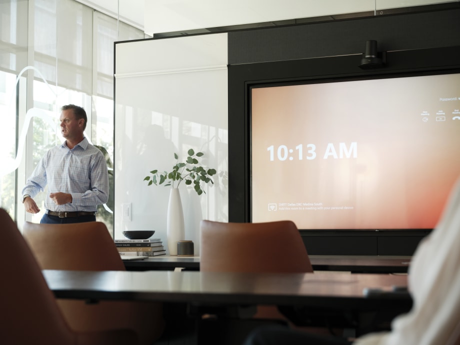 Large meeting room with integrated technology in the wall to enable screen sharing