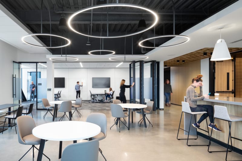 DIRTT's folding glass wall easily folds away to open up an office space.