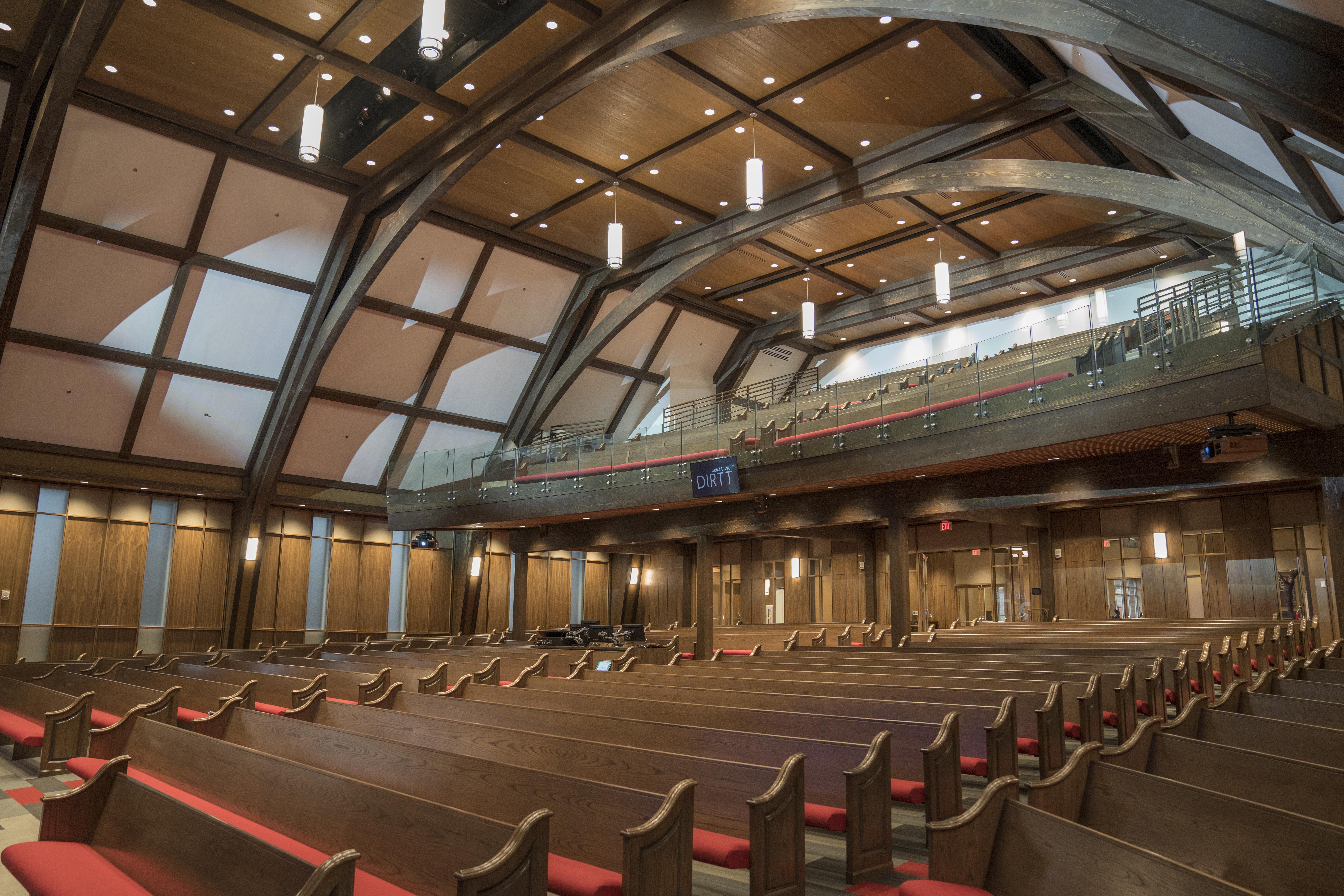 Wide view of performance art center with timber frame canopies and seating