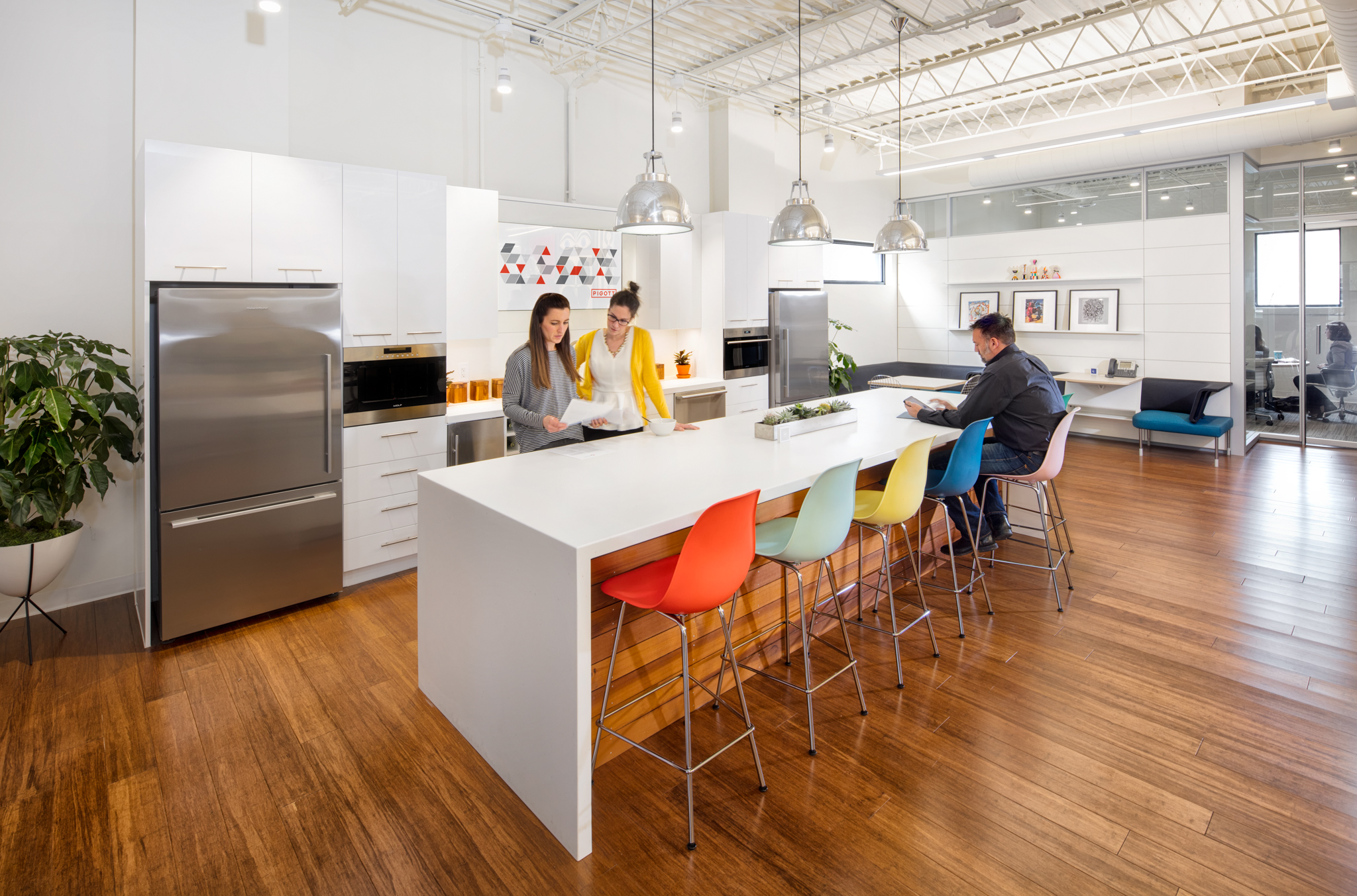 This kitchen area in a DIRTT design center features custom casework and solid modular walls.
