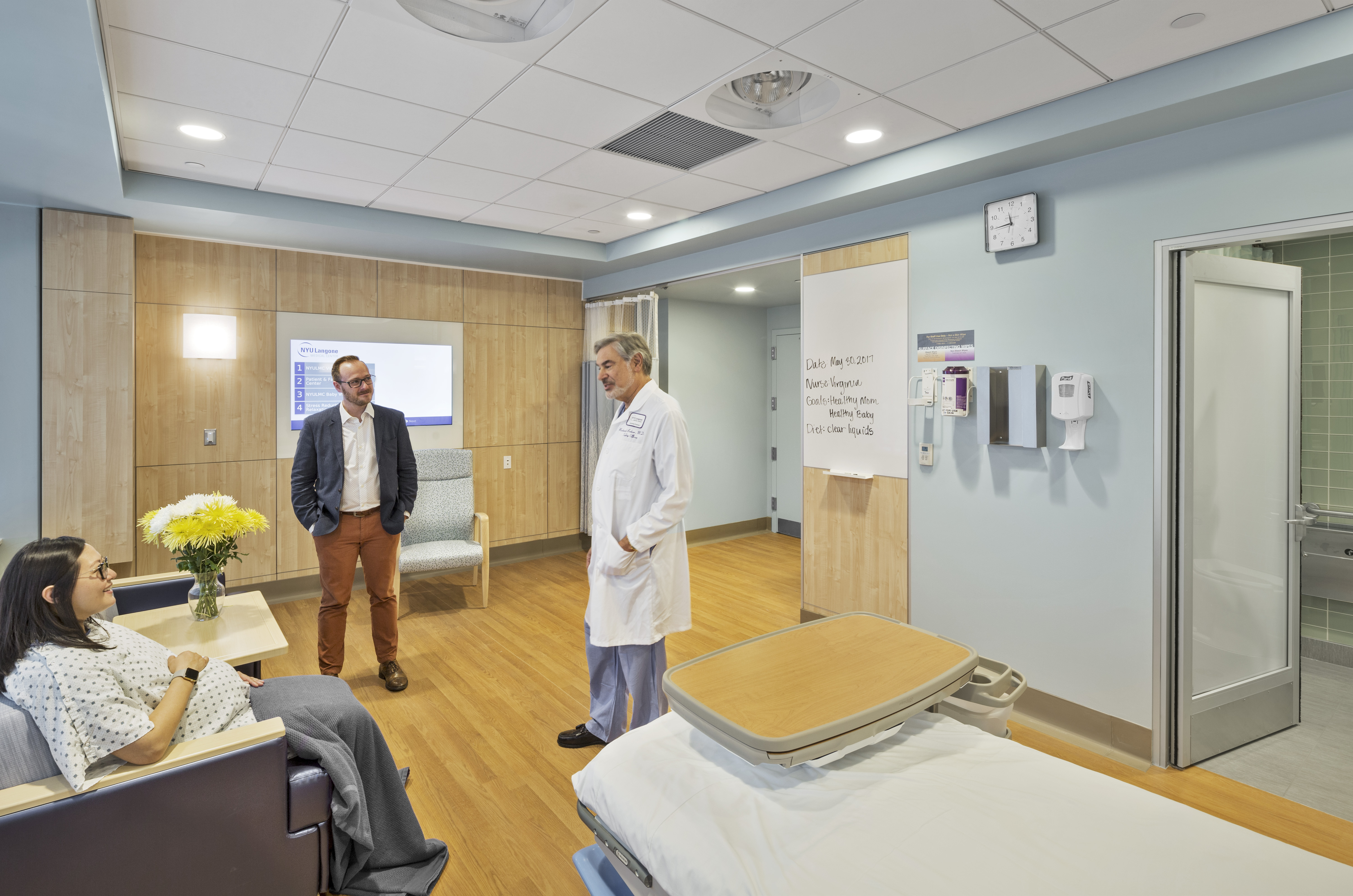 This patient area features DIRTT solid modular walls in veer finish with integrated technology and writeable surfaces.