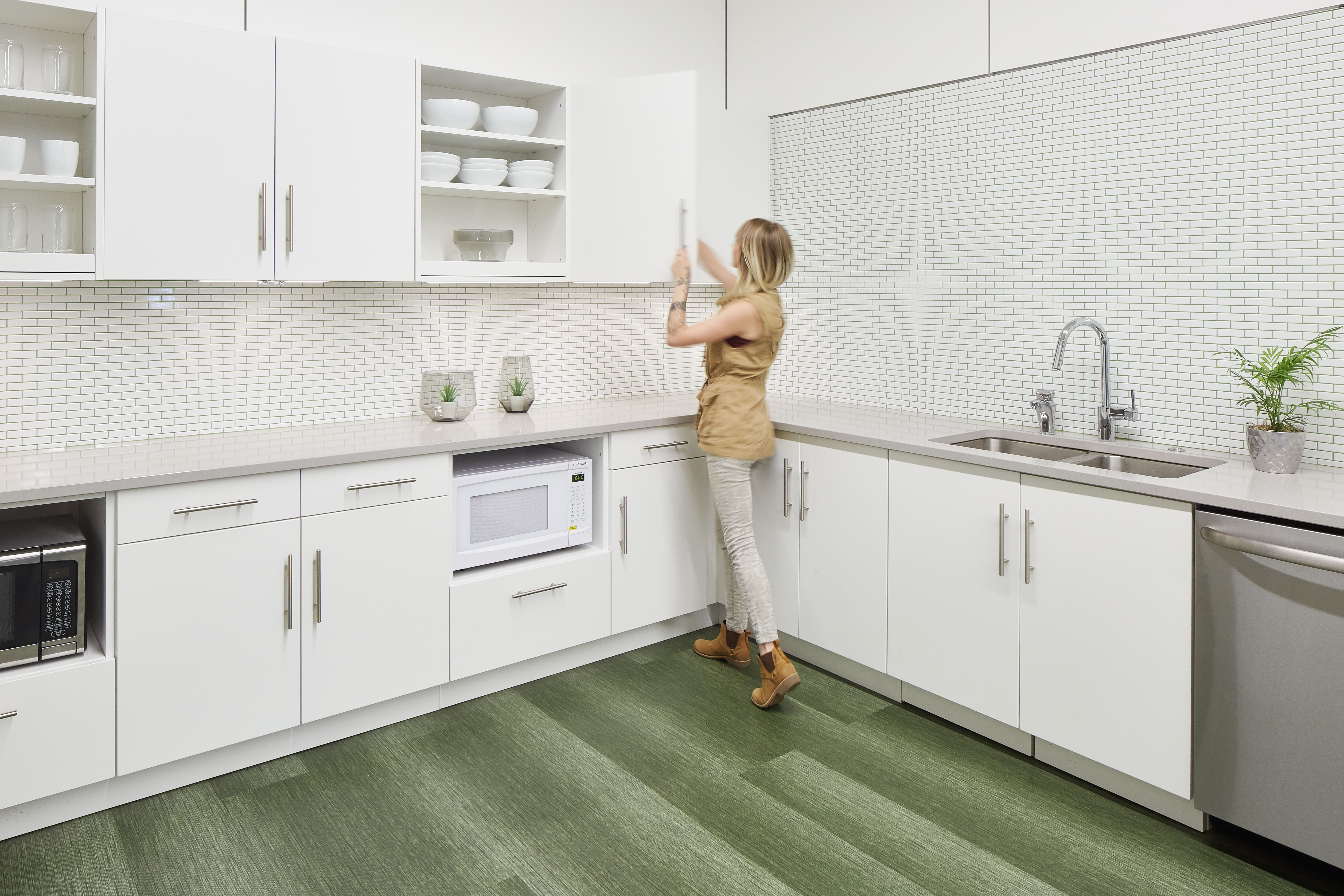 This kitchen area features DIRTT's custom casework cabinetry.