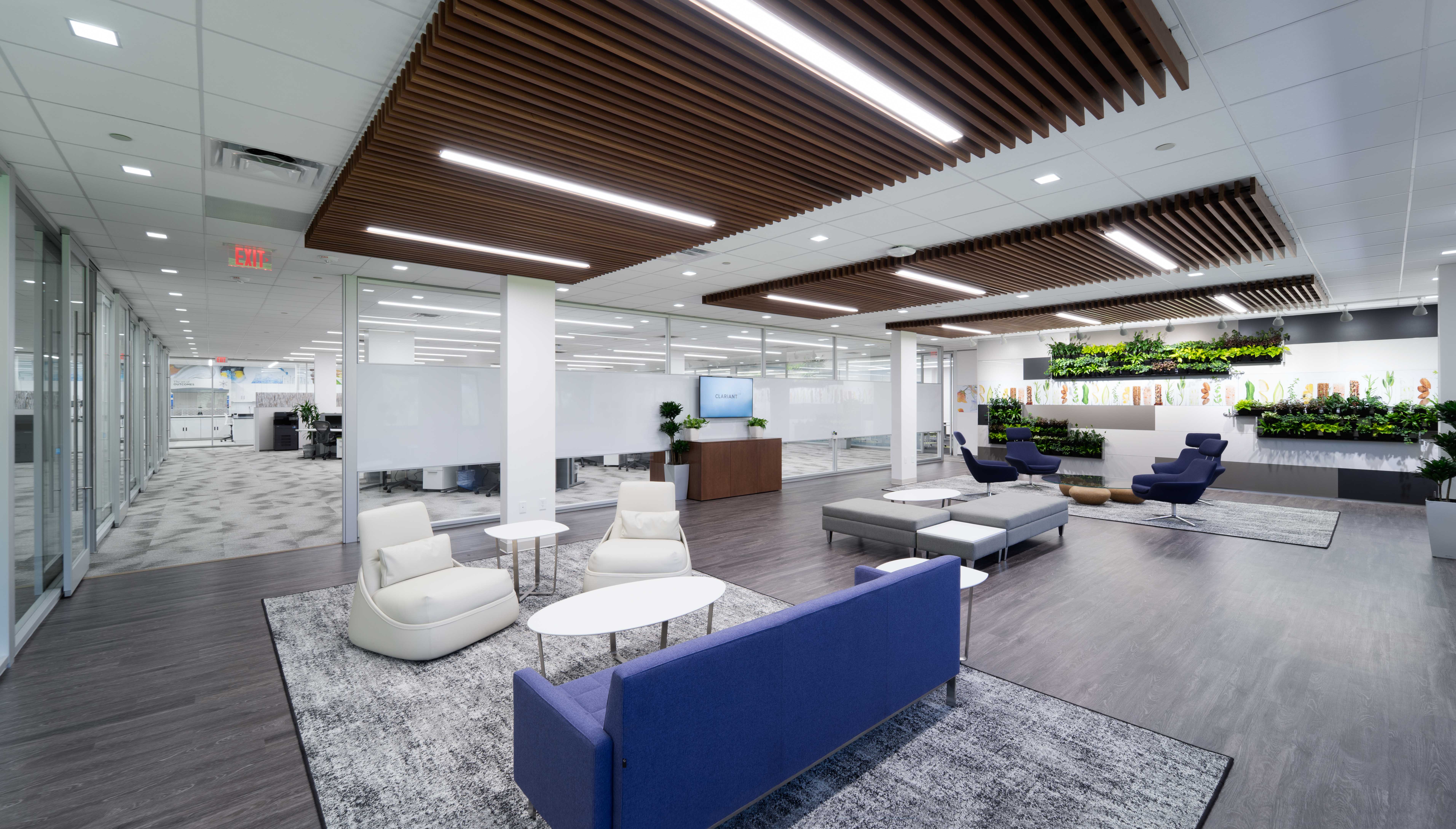 The waiting area is separated from the open work area with a combination solid and glass modular wall.
