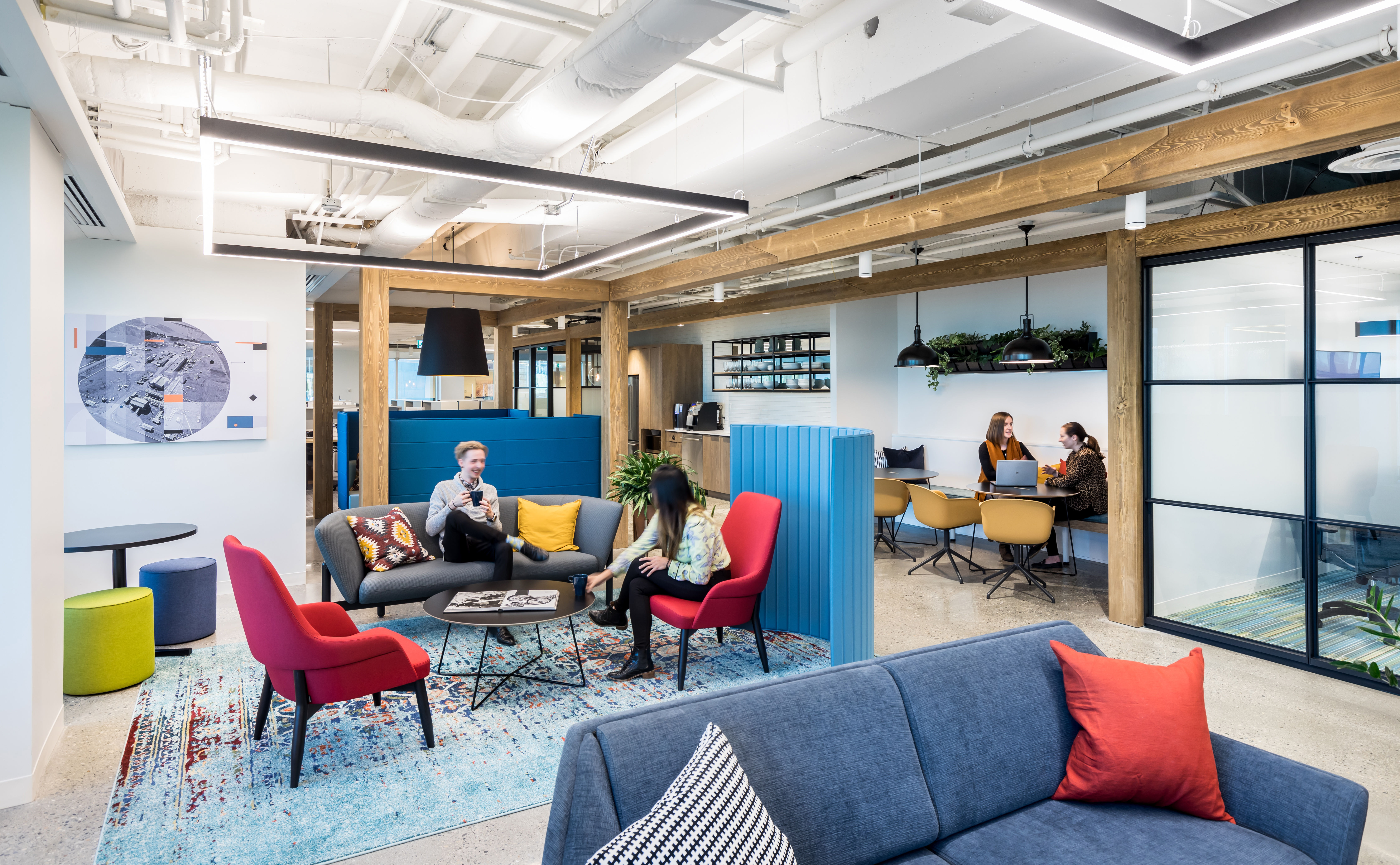 DIRTT's Timber Frame warms up a casual office seating area and open meeting space.