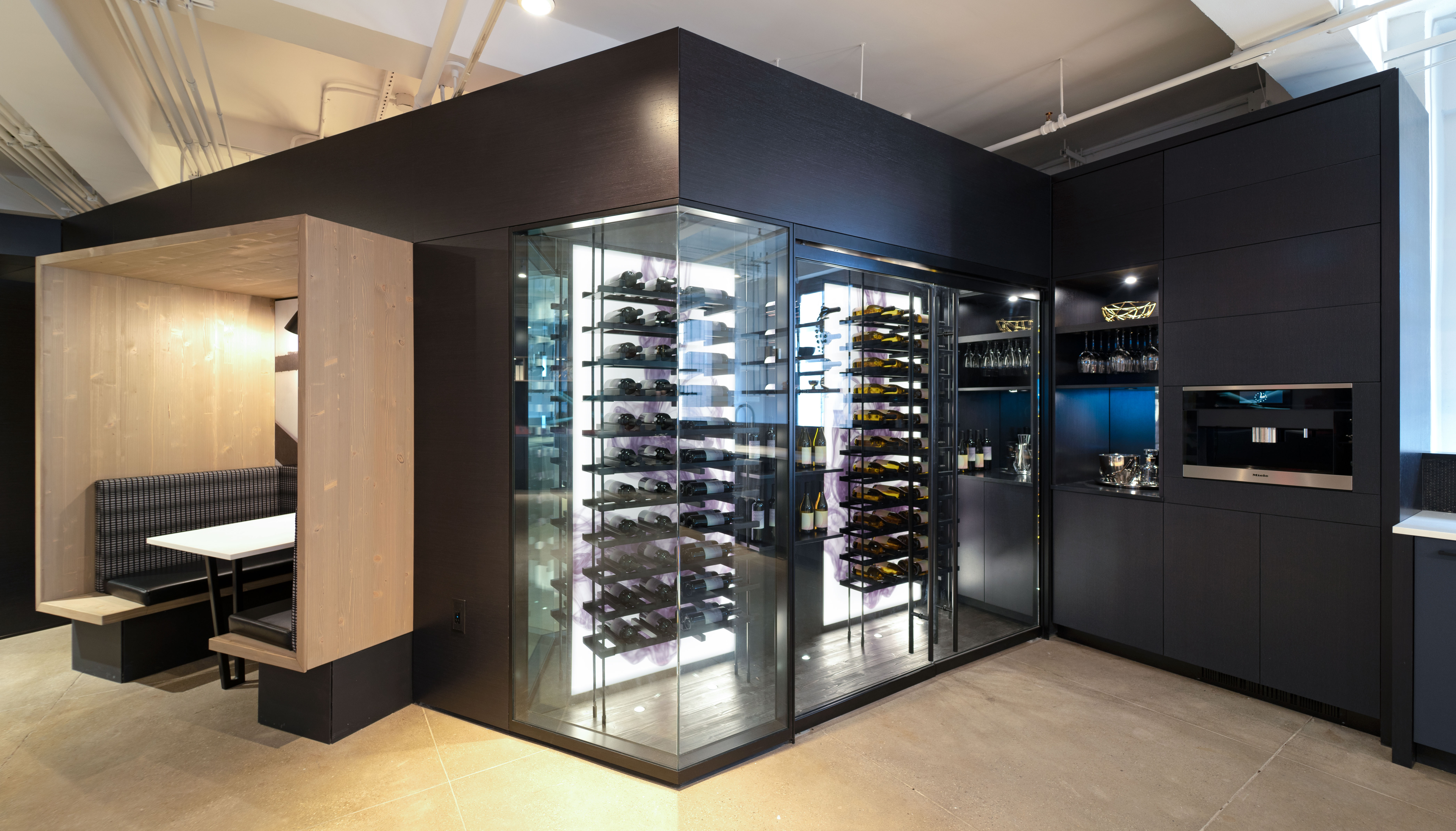 This DIRTT kitchen area features custom casework for the java center and a double pane enclosed wine room.