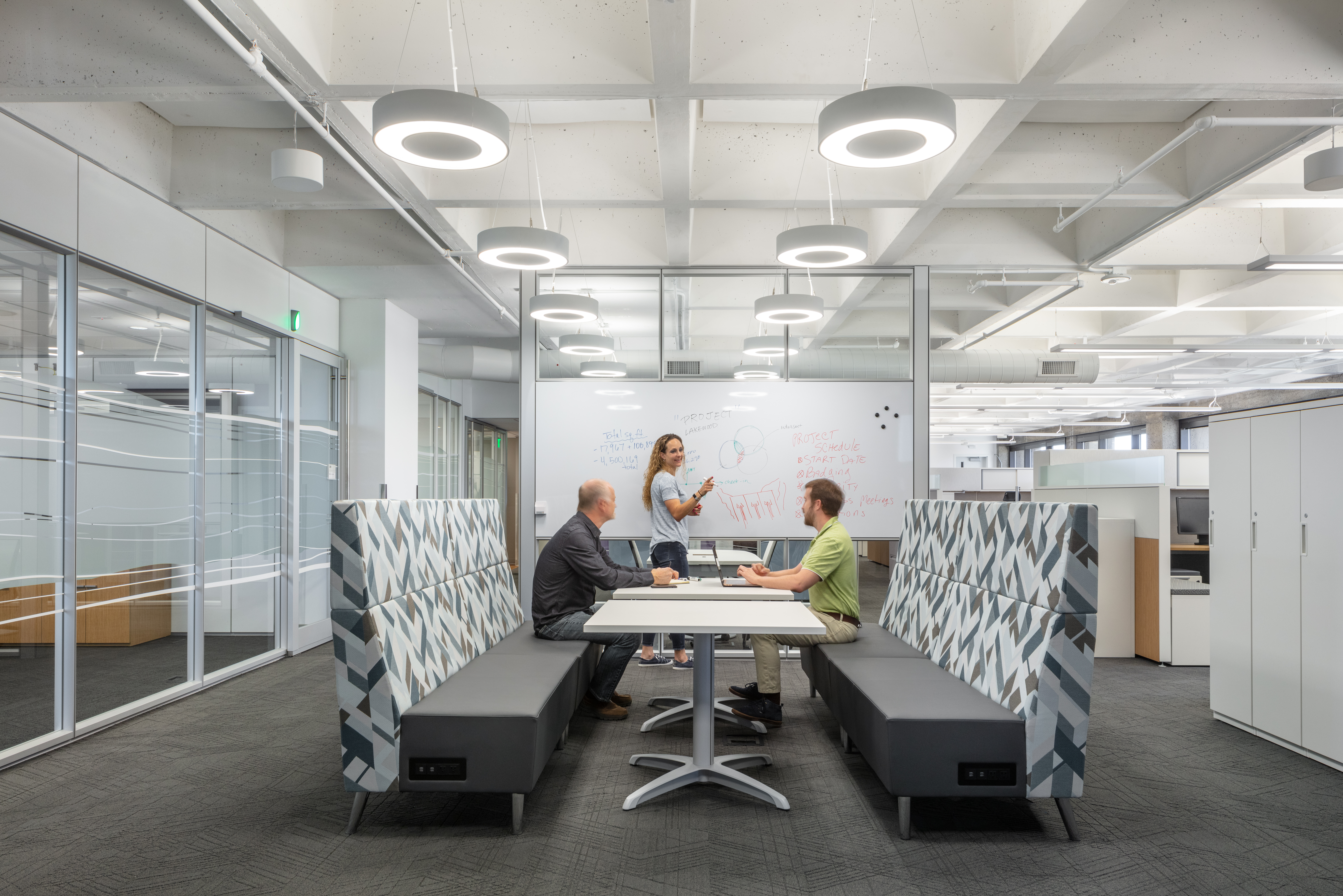 Federal office building open space with raised floor system, prefab office walls with whiteboard-like writeable space