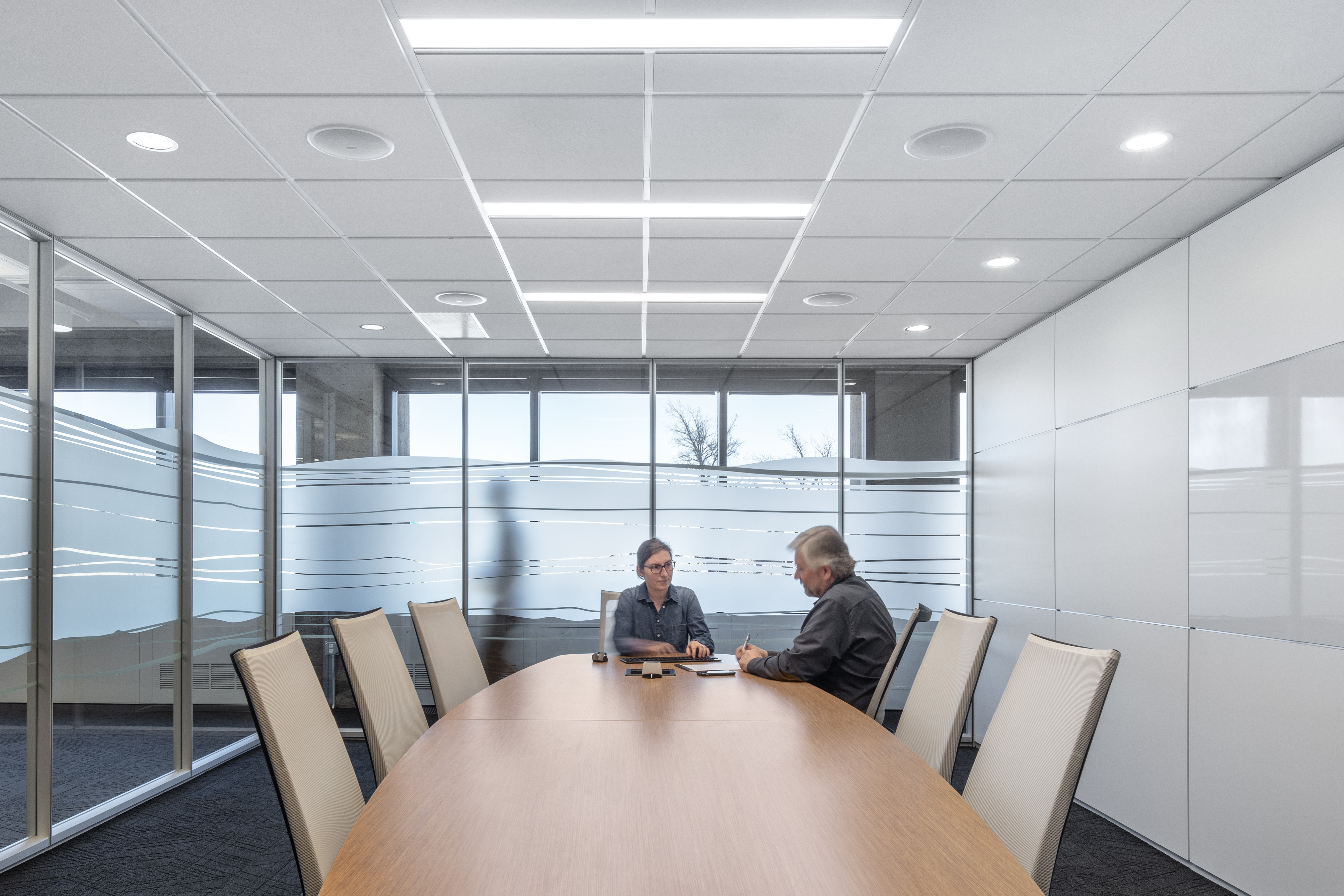 Federal office building meeting room with raised floor system, prefab office walls with whiteboard-like writeable space and custom graphics