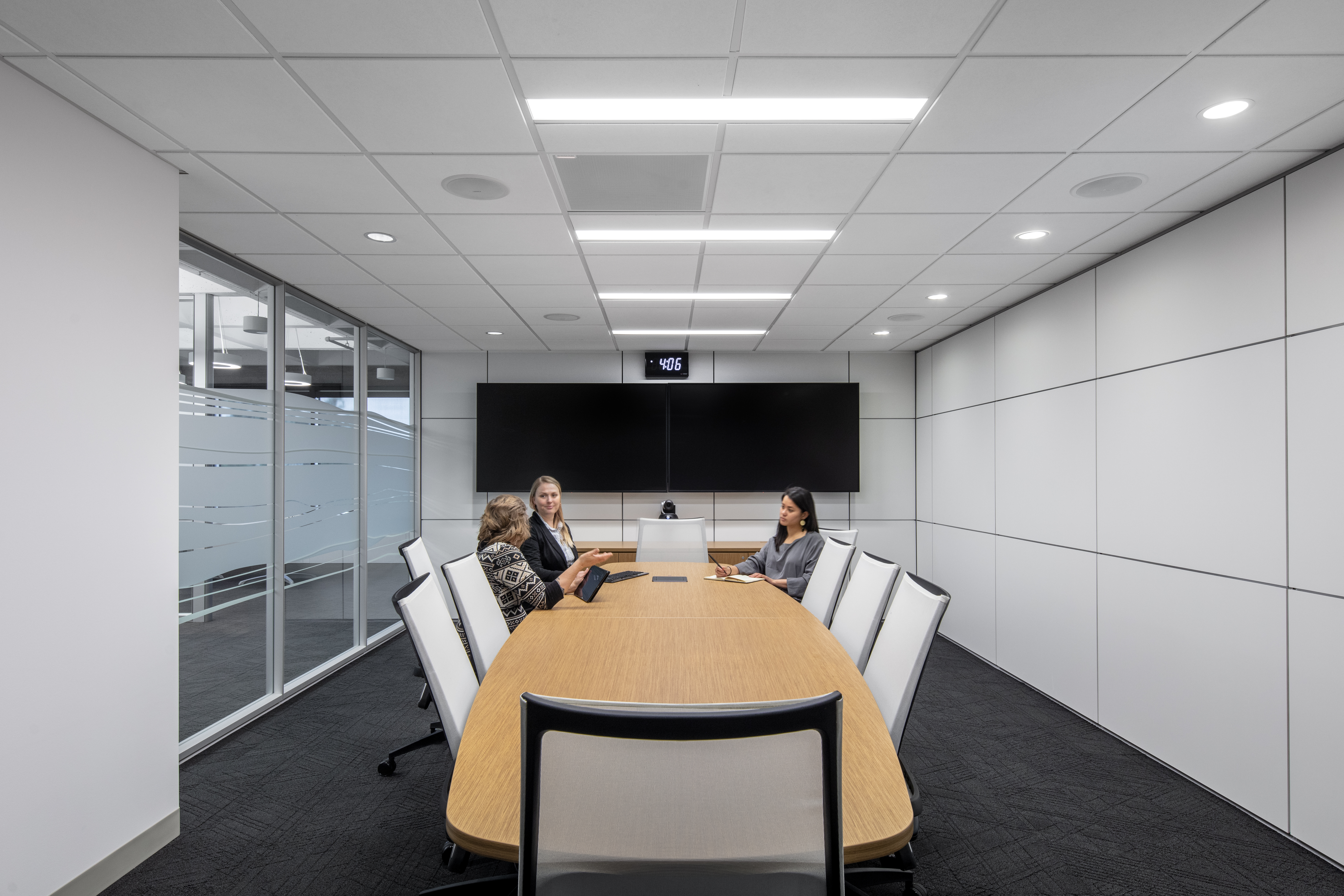 Federal office building meeting room with raised floor system, prefab office walls with whiteboard-like writeable space and custom graphics