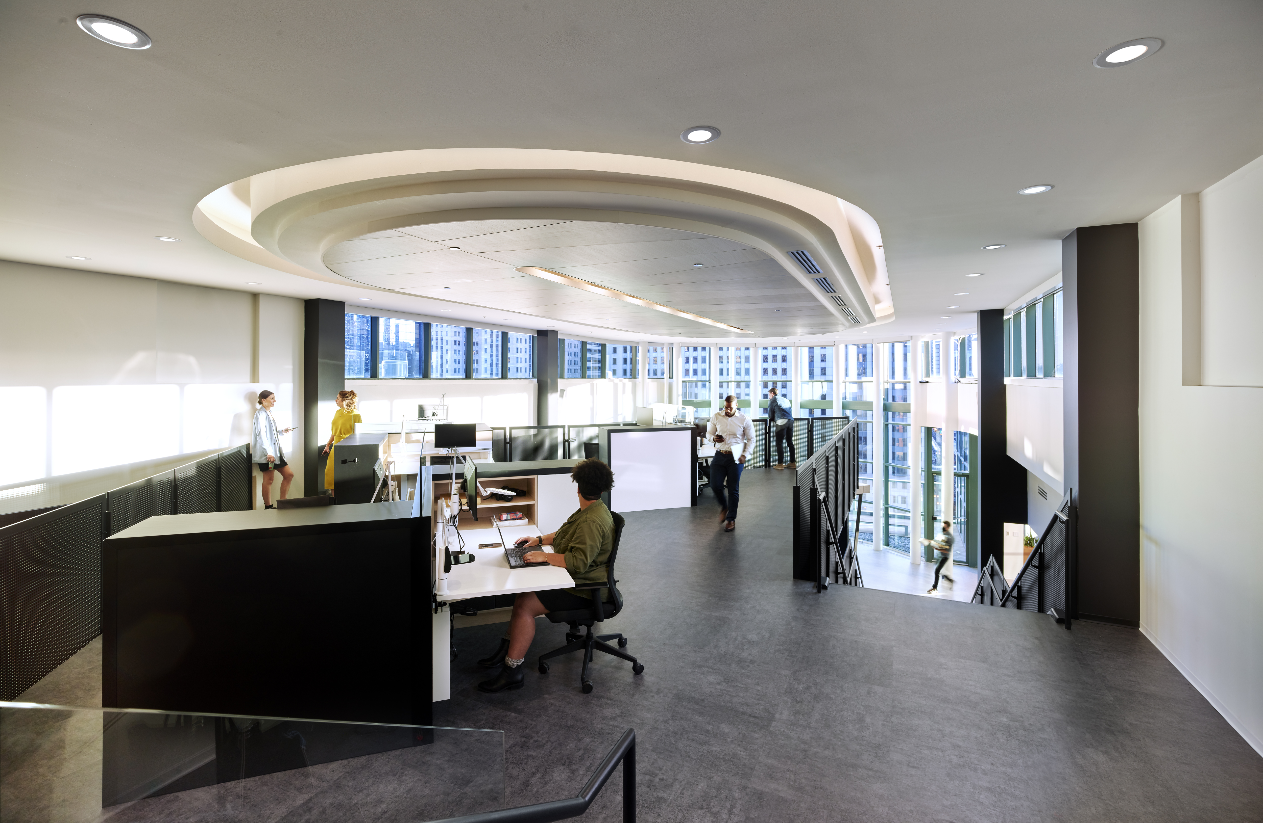 This upper loft area has sit stand desks in an open environment.