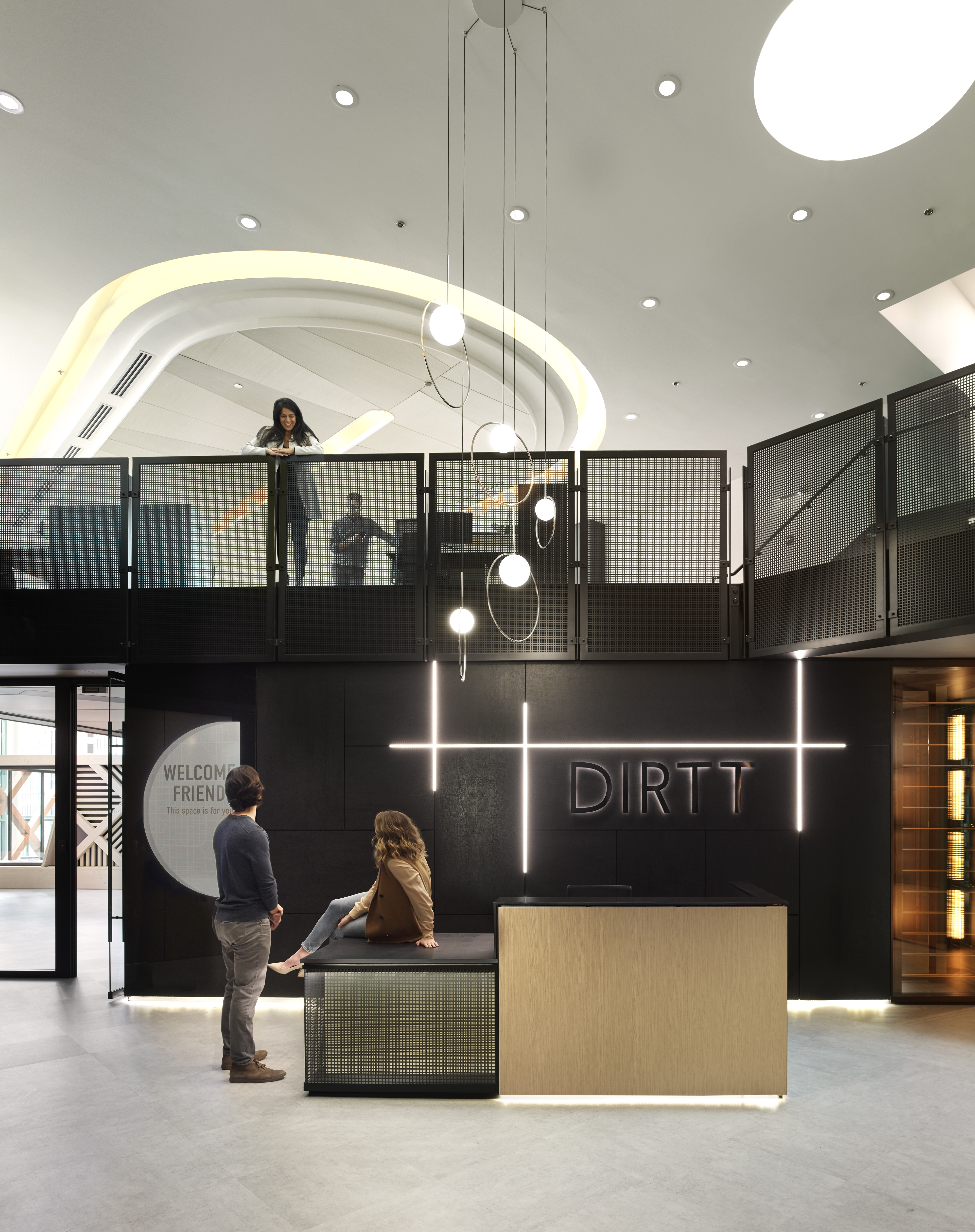 This reception area is open to the floor above and features a 21 foot solid DIRTT wall with integrated lighting.