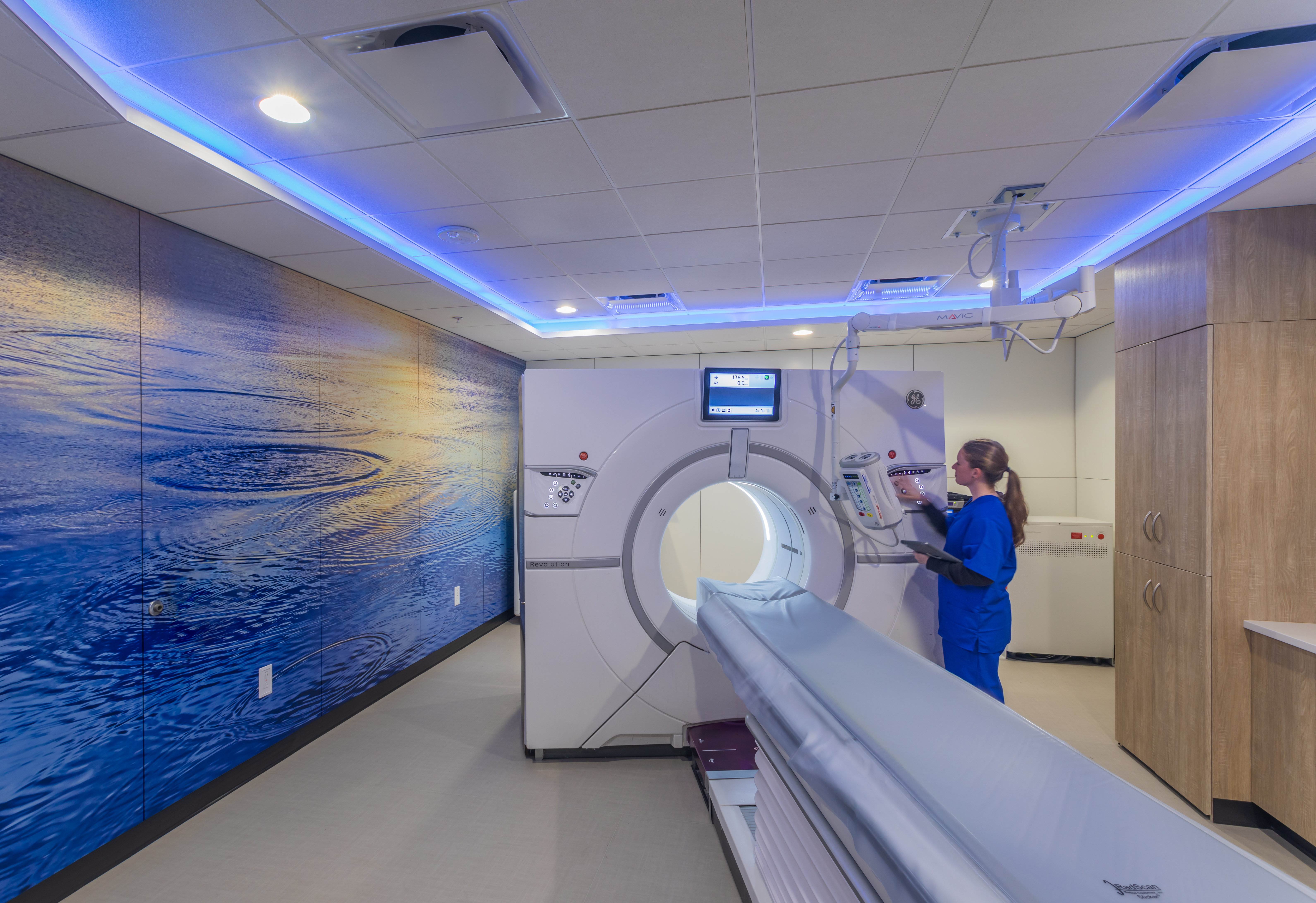 Image of graphic wall panels going across a MRI room with calming artwork applied