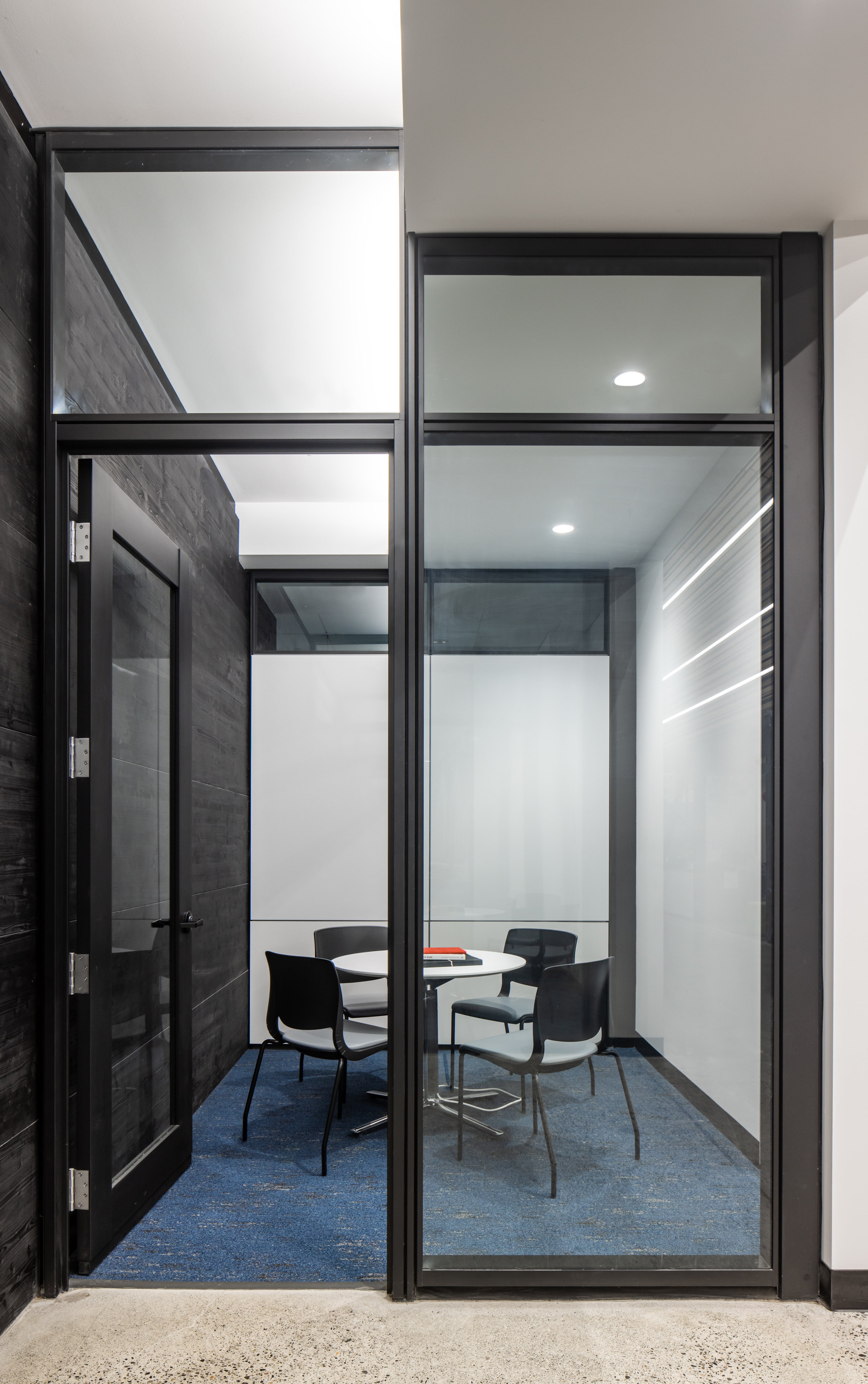 Detail view of university meeting room with prefab glass doors