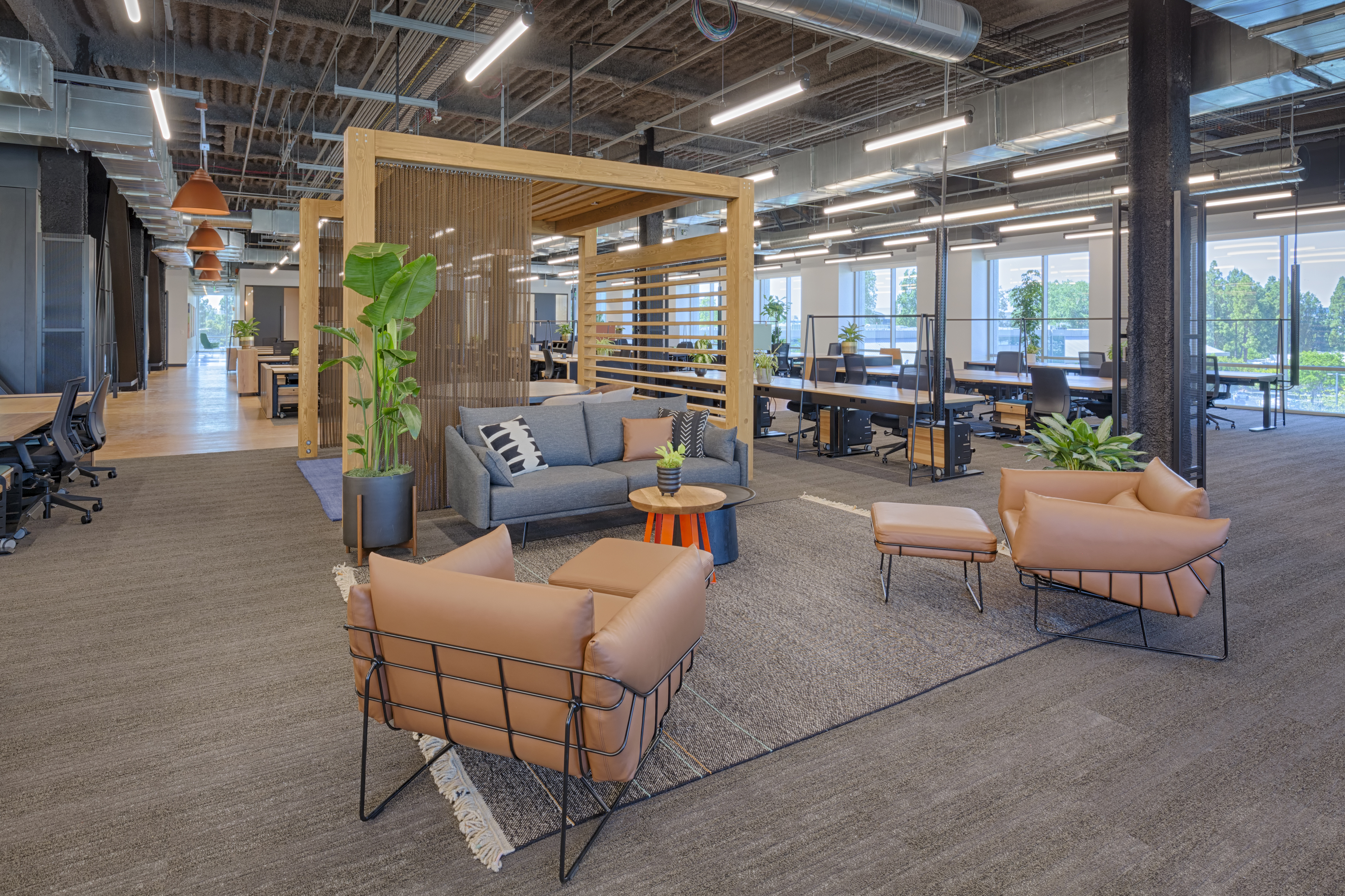 Custom Timber canopies from DIRTT frame seating areas in the Google Crossman office.