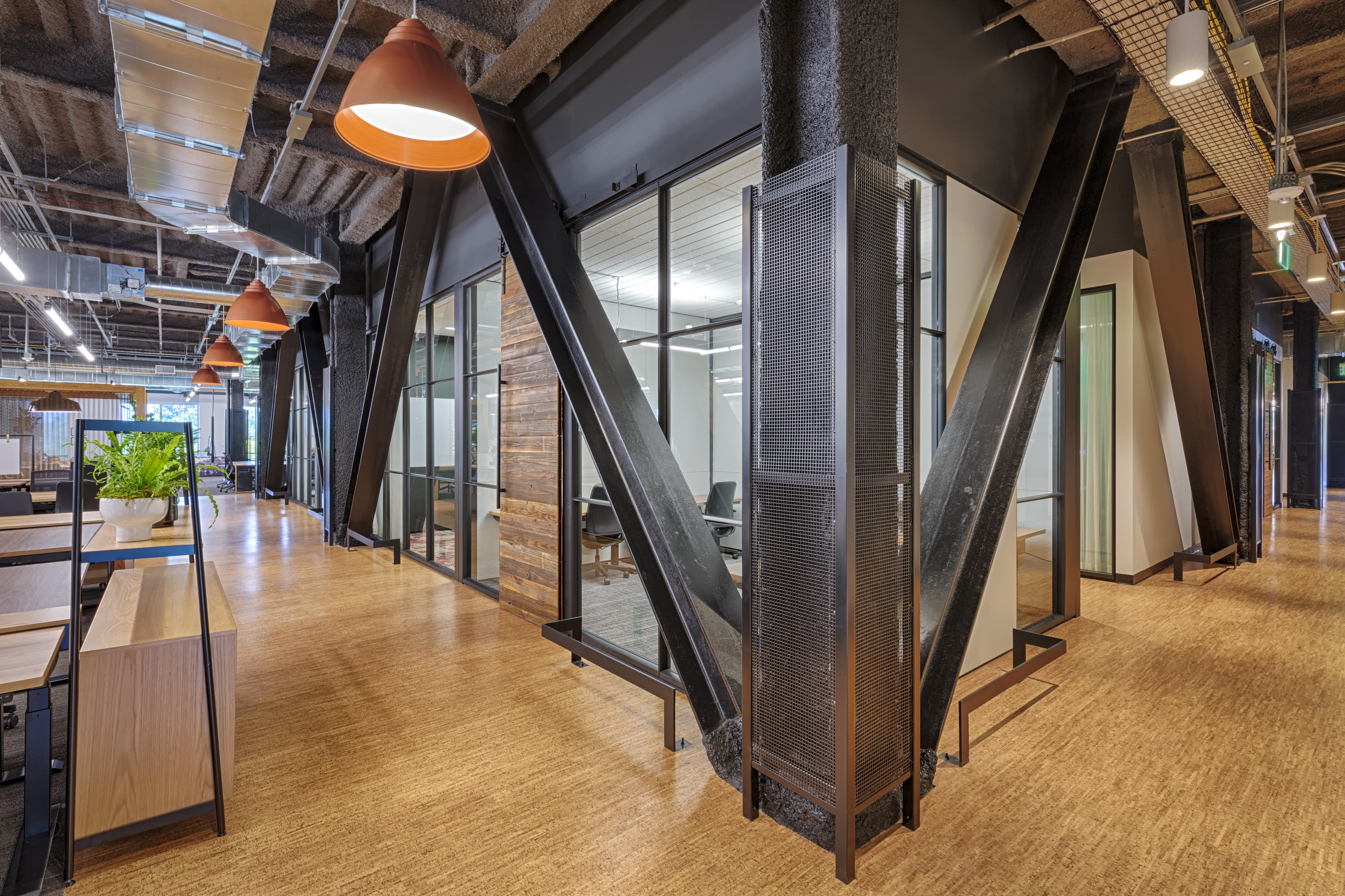 Slim profile glass walls from DIRTT divide work spaces and offices at Google Crossman.
