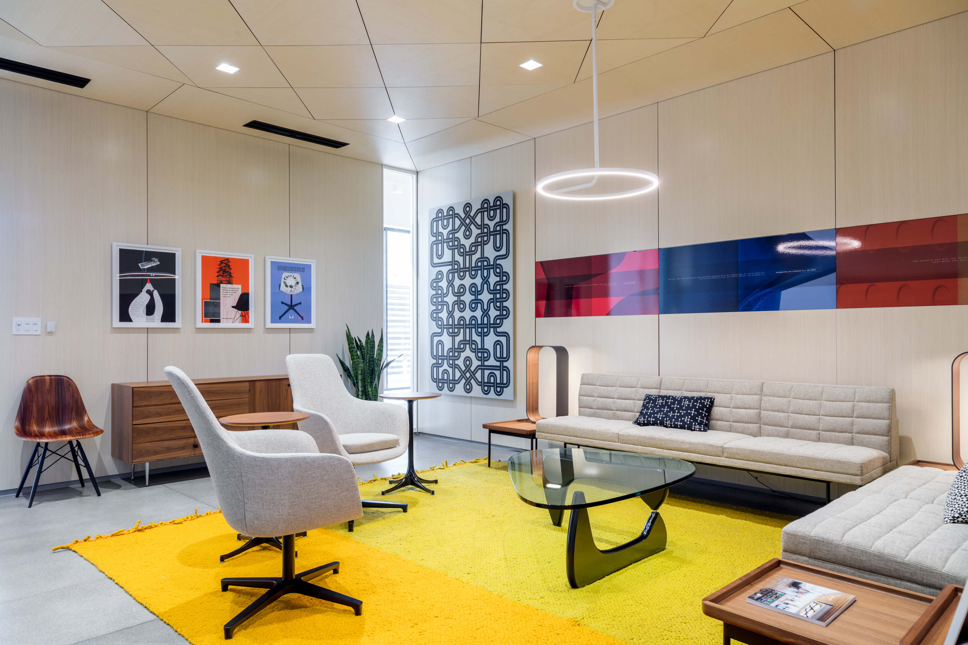 Modular solid walls with integrated graphic artwork shown in a office lounge environment