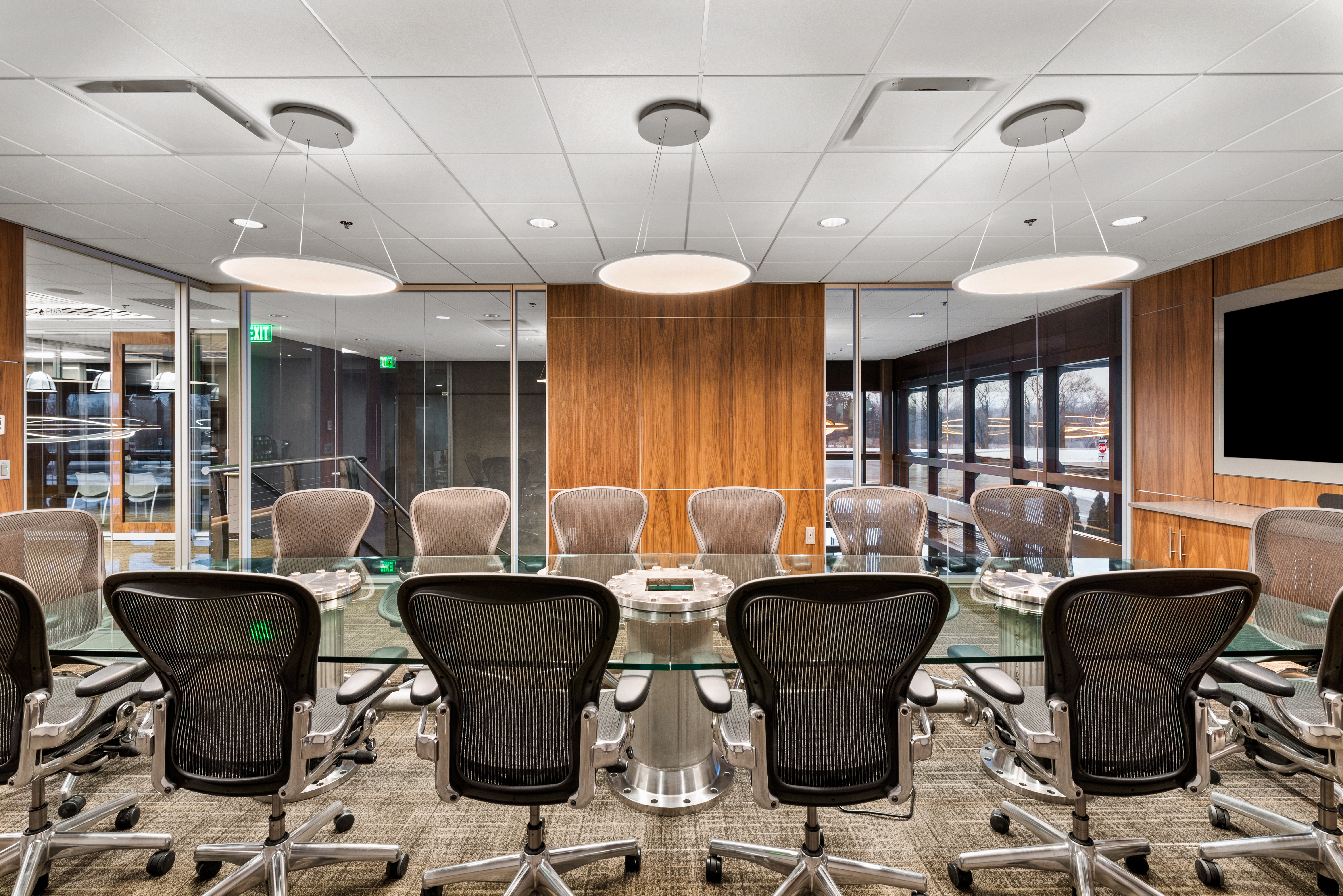 Combination glass and solid veneer modular walls are used for this conference room.