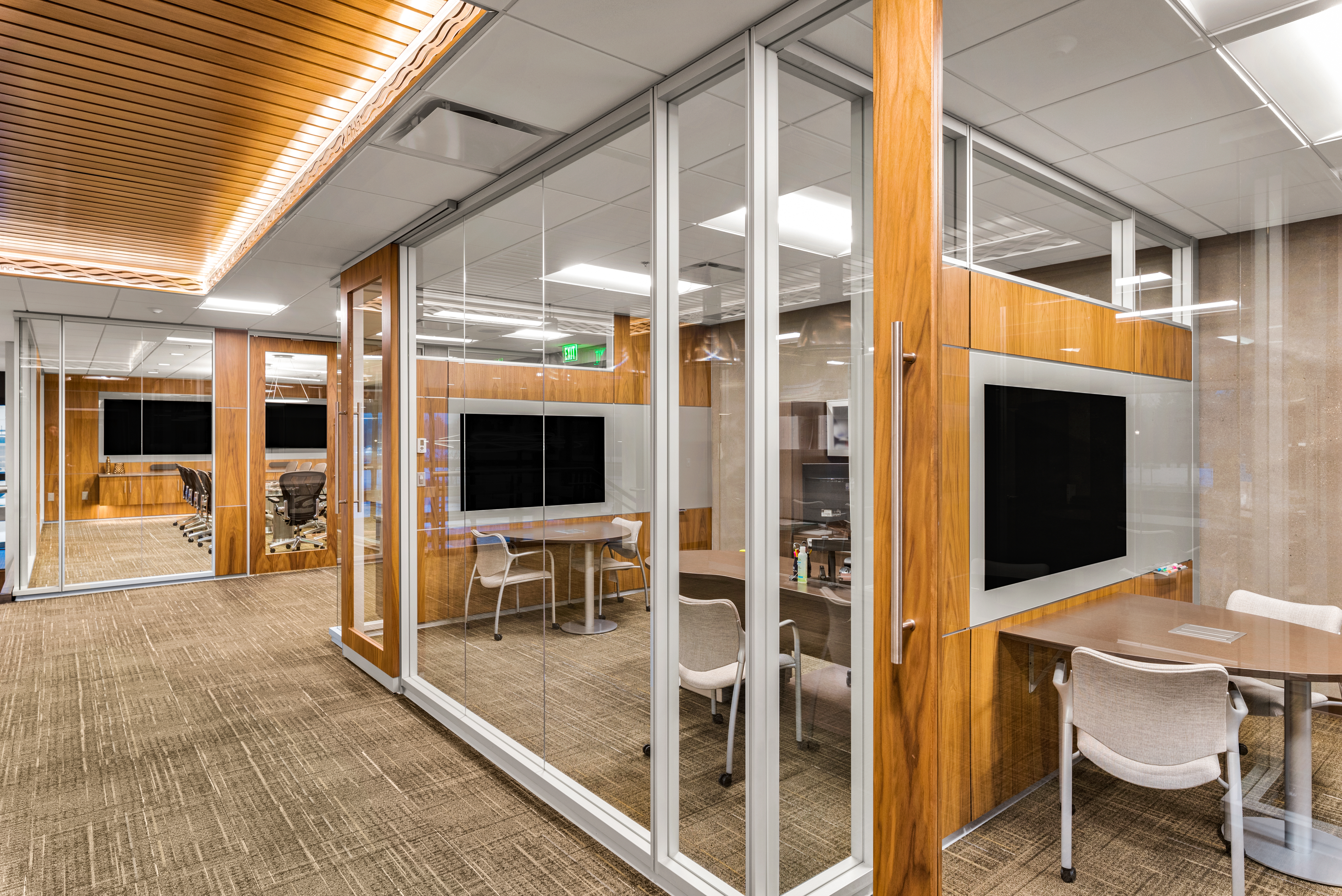 Private offices and meeting spaces have been created with a combination of solid and glass modular walls.