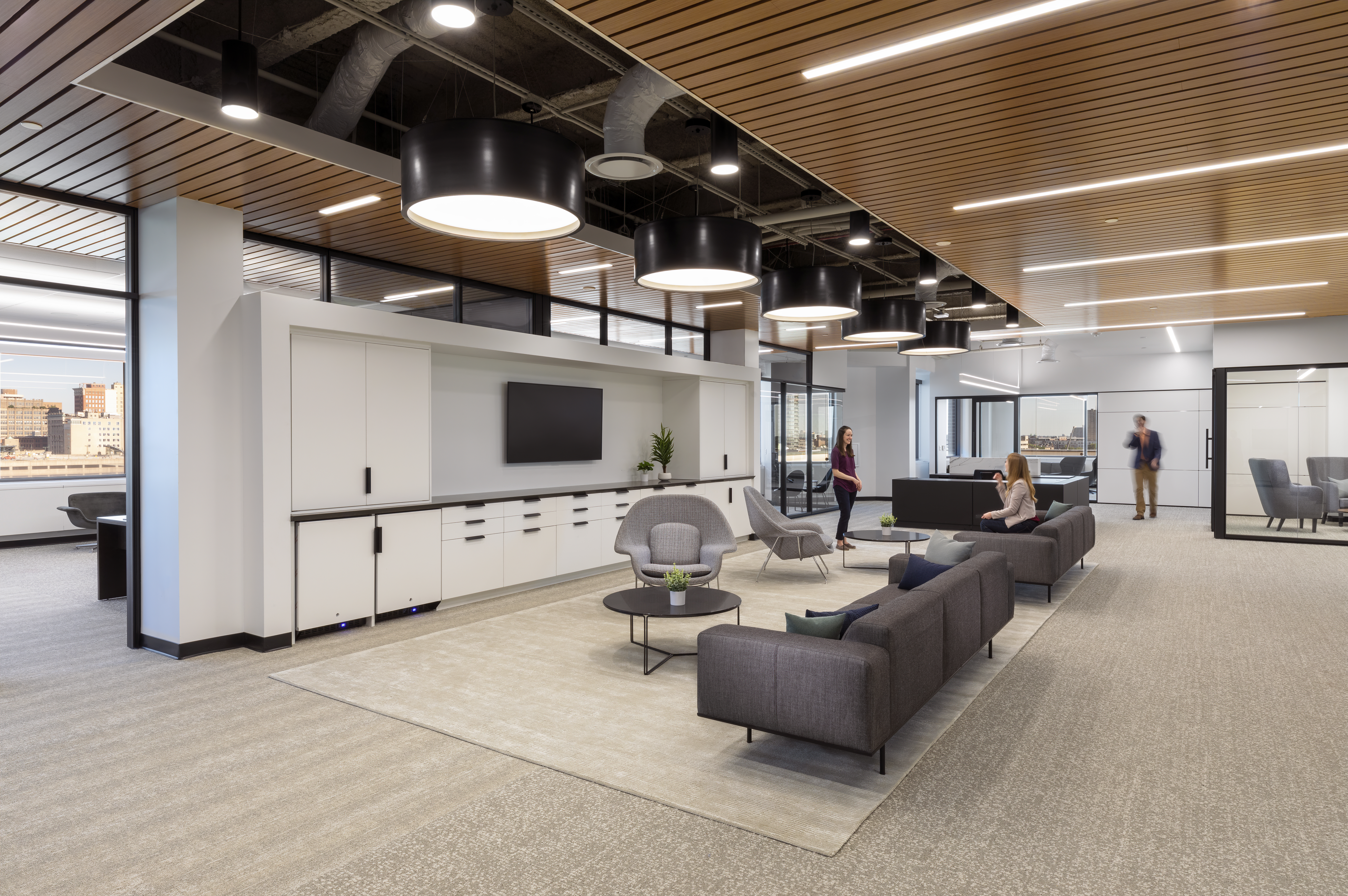 This open waiting area faces a long stretch of DIRTT's custom casework cabinets and drawers.