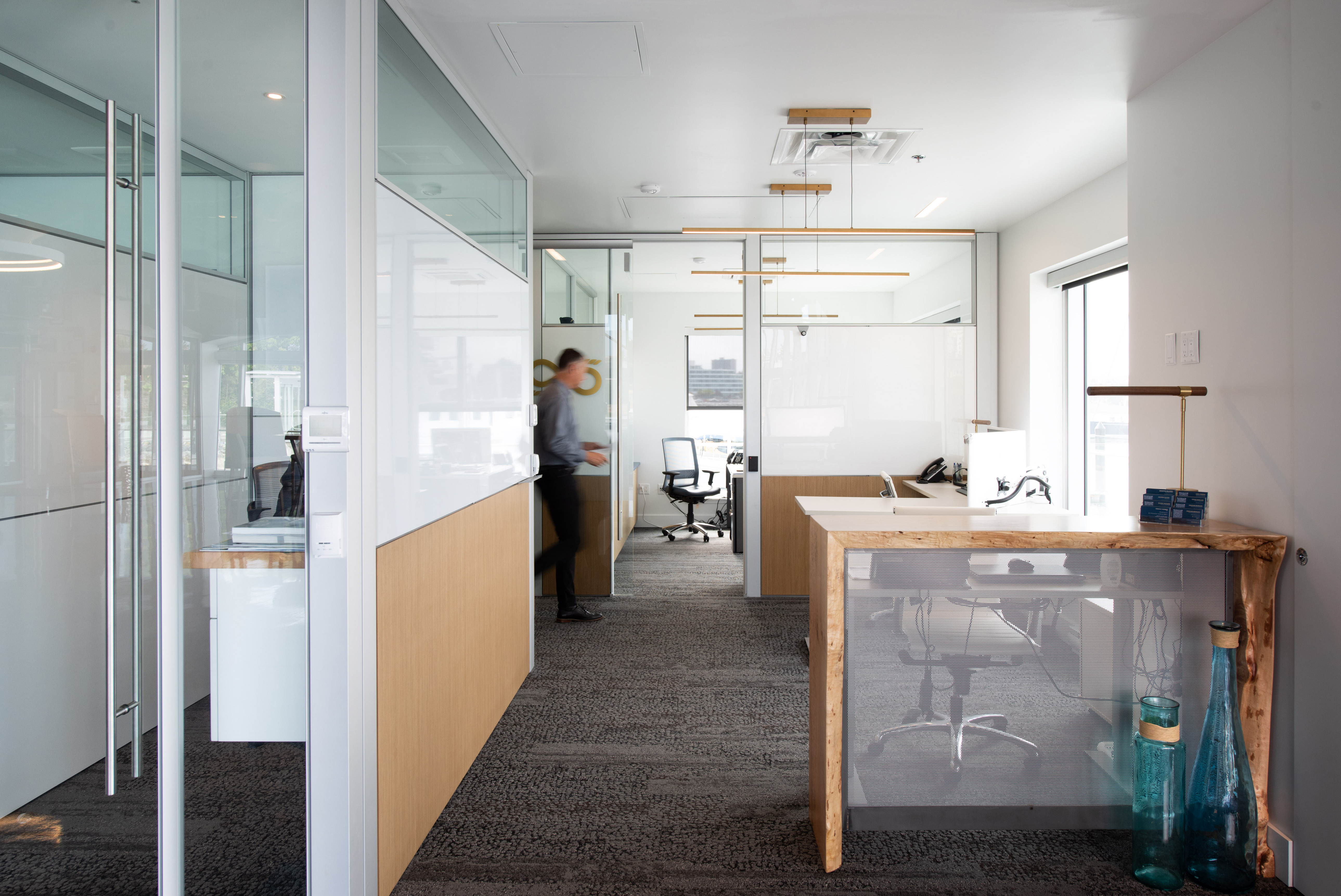 Combination of modular solid and glass walls in a office environment shown