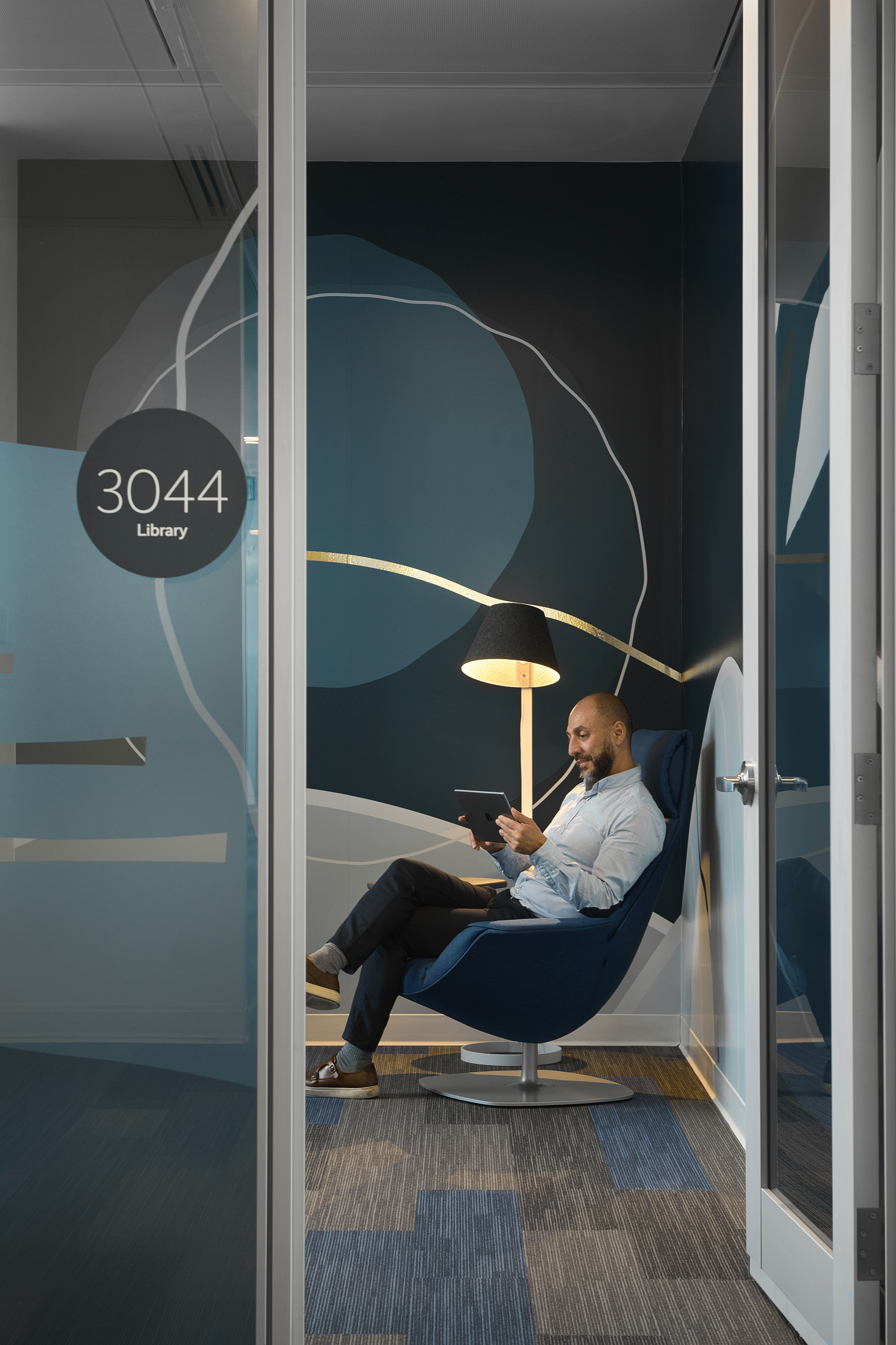 Image of a glass wall door to a private office