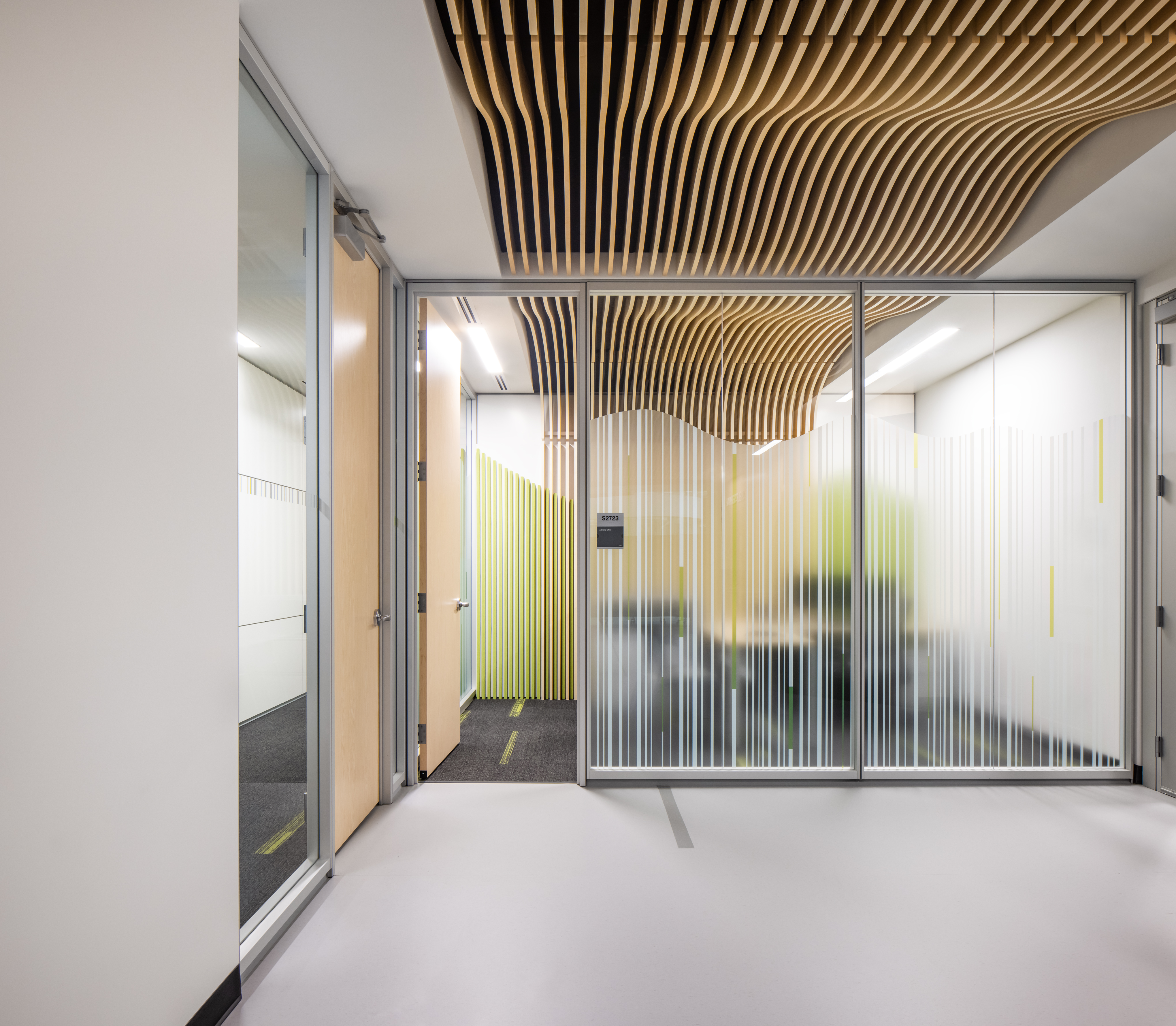 College student center with prefab glass walls with custom graphics