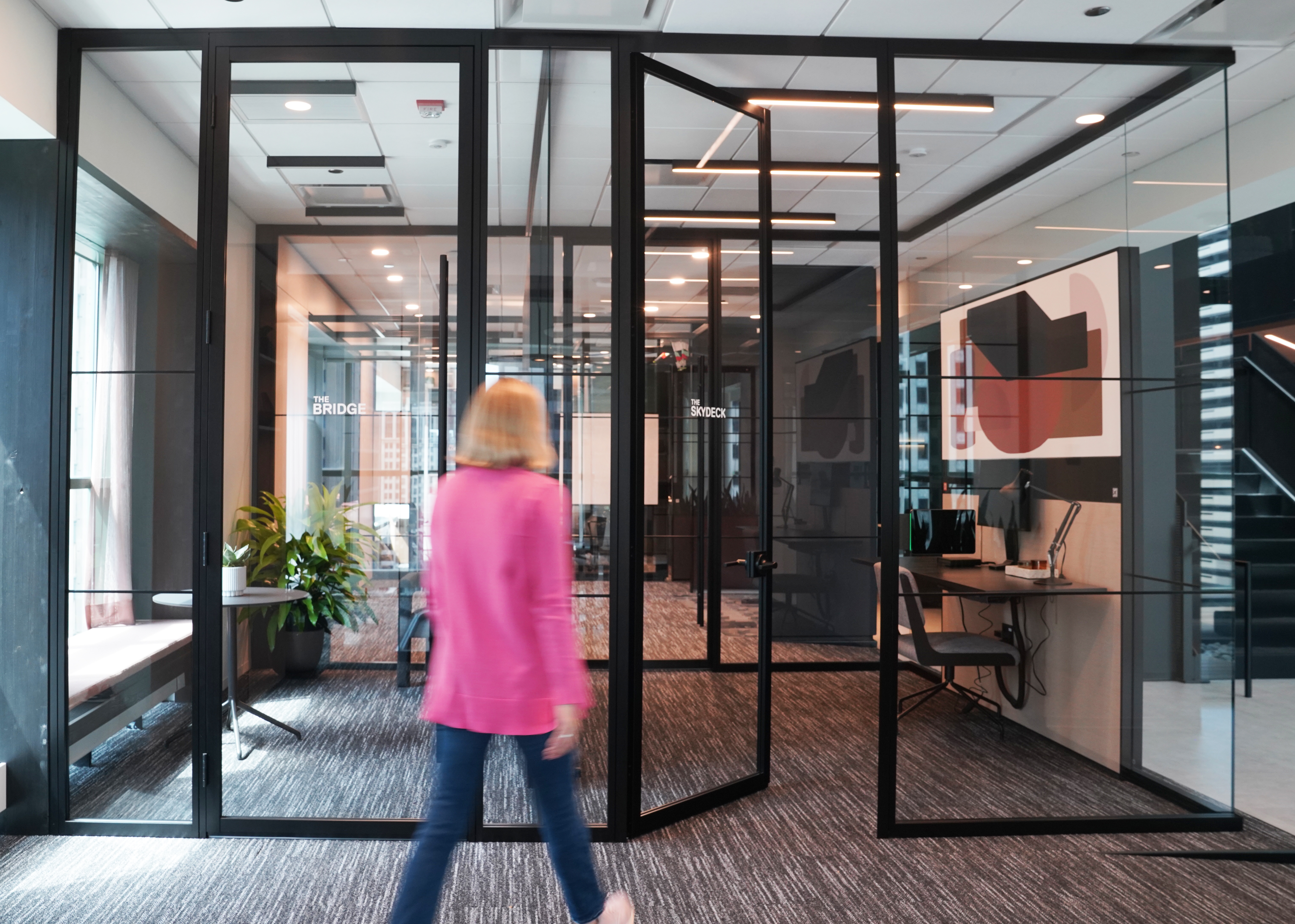 Office meeting rooms featuring DIRTT Glass Walls and Spectra Swing Doors.