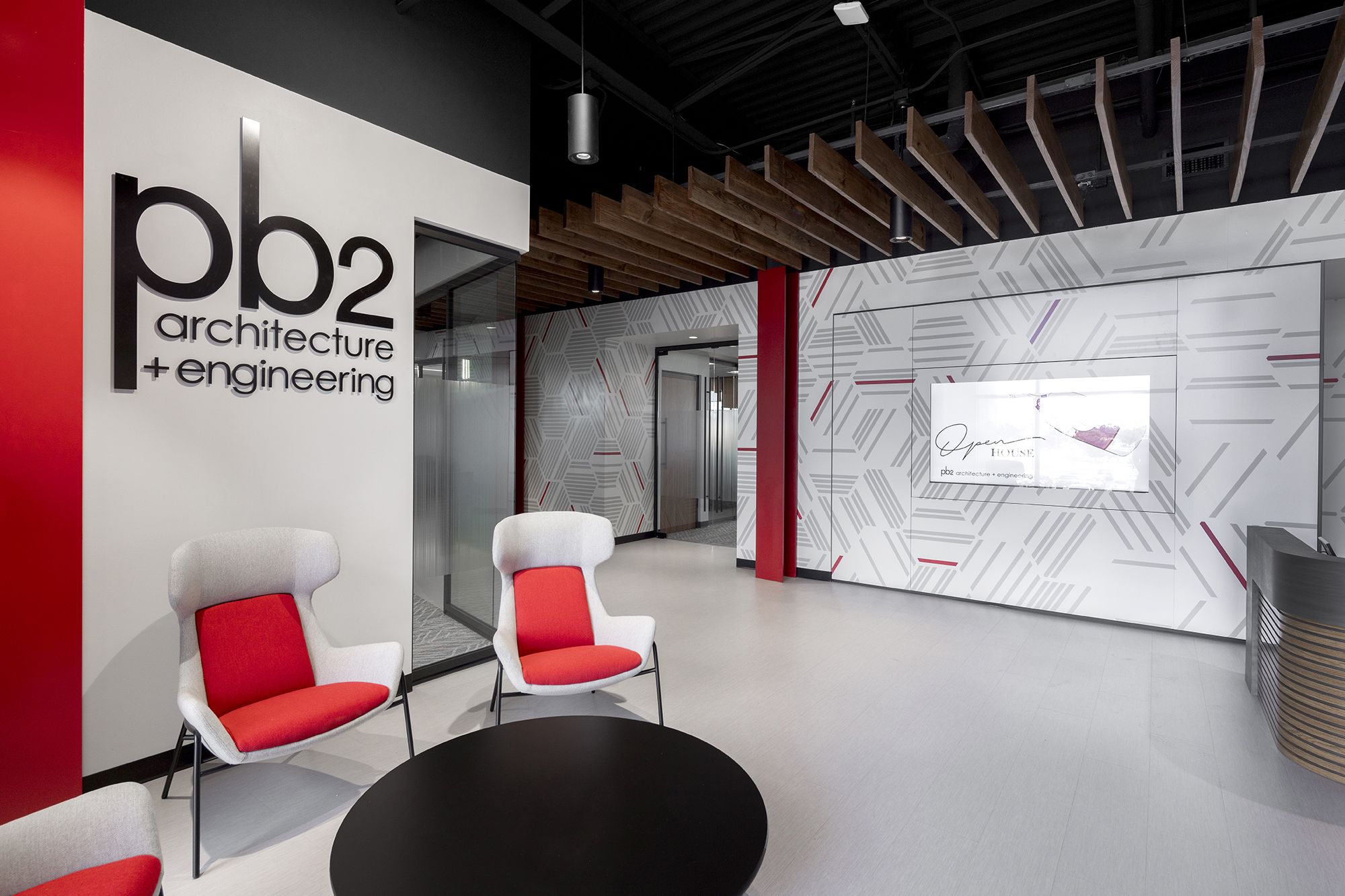 DIRTT project pb2 architecture + engineering featuring: 4 inch solid wall, applied film, backpainted glass, custom graphics, glass integrated display, glass wall, inspire frameless glass pivot door, inspire glass wall, integrated technology, powder coat, solid wall