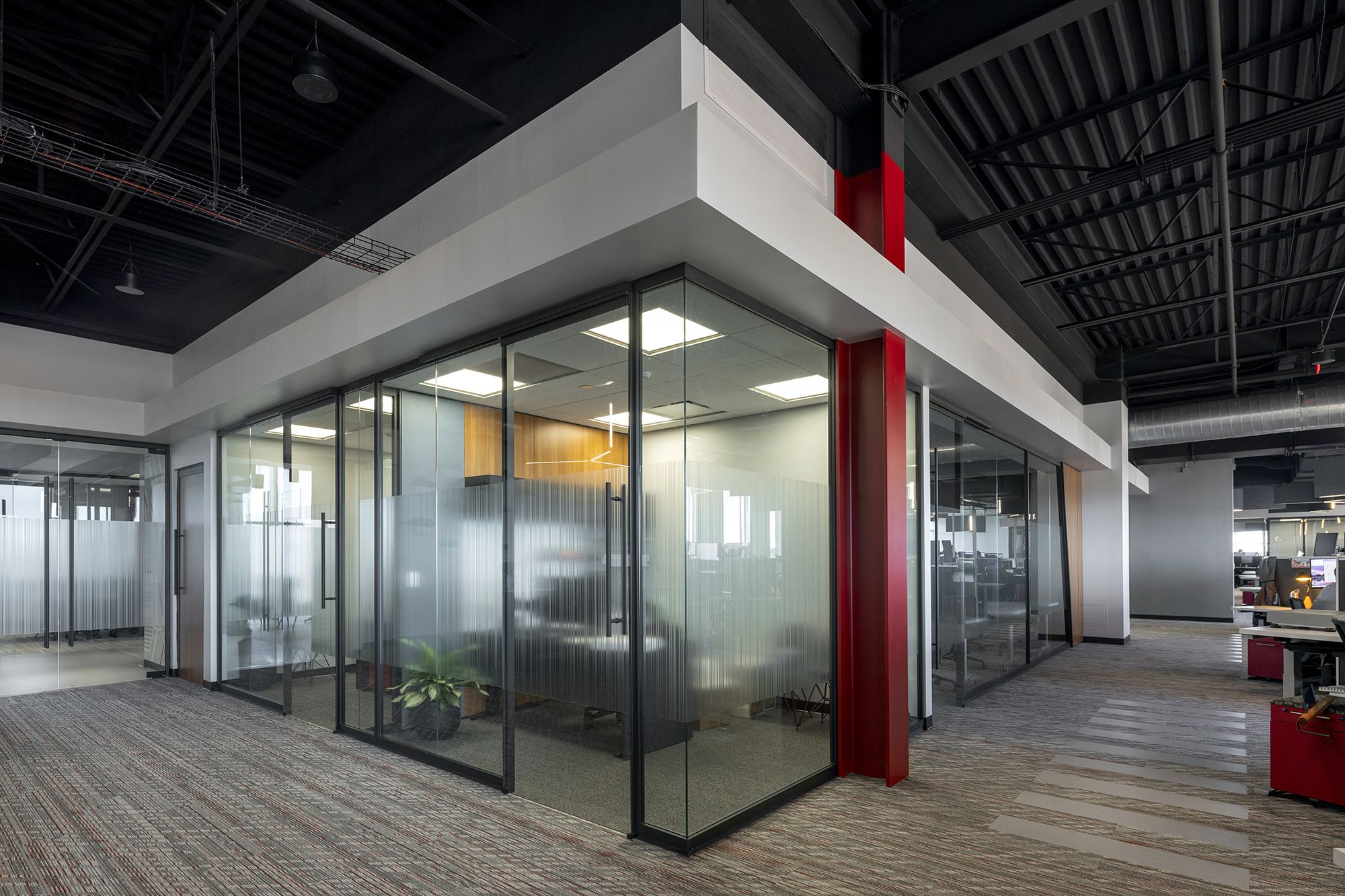 DIRTT project: pb2 architecture + engineering 4 inch solid wall, angled panels, applied film, hallway, inspire 90 degree corner, inspire frameless glass sliding door, inspire glass wall, powder coat, private office, solid wall, veneer